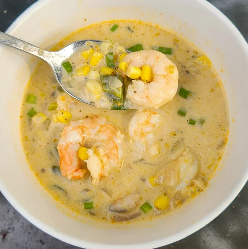 Creamy shrimp and corn bowl with green onion
