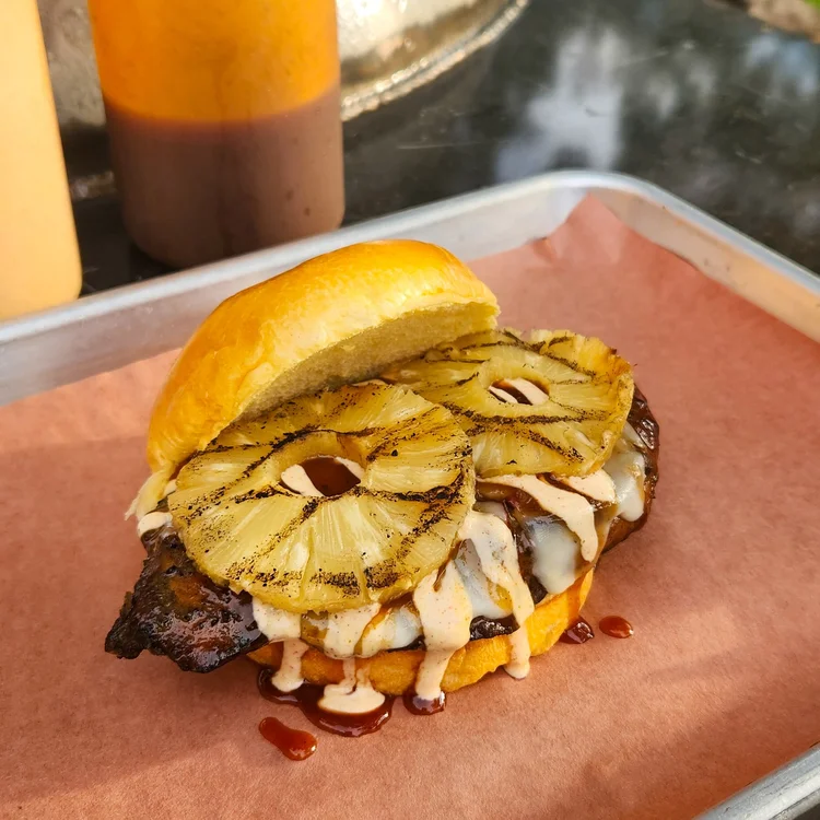 Barbecue sandwich topped with grilled pineapple
