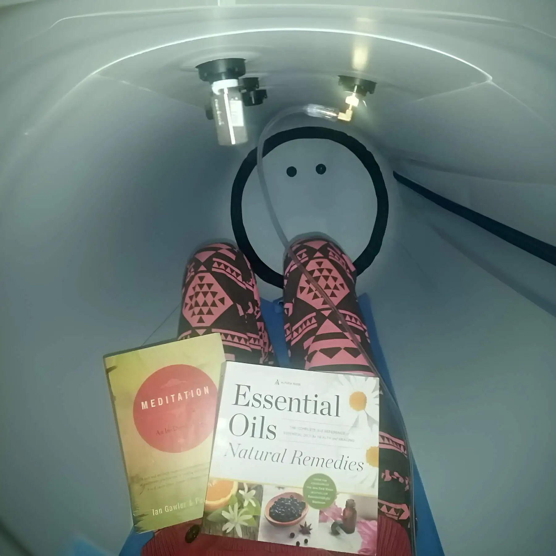 newtowne-hyperbaric-chamber-customer-reading-book.jpg