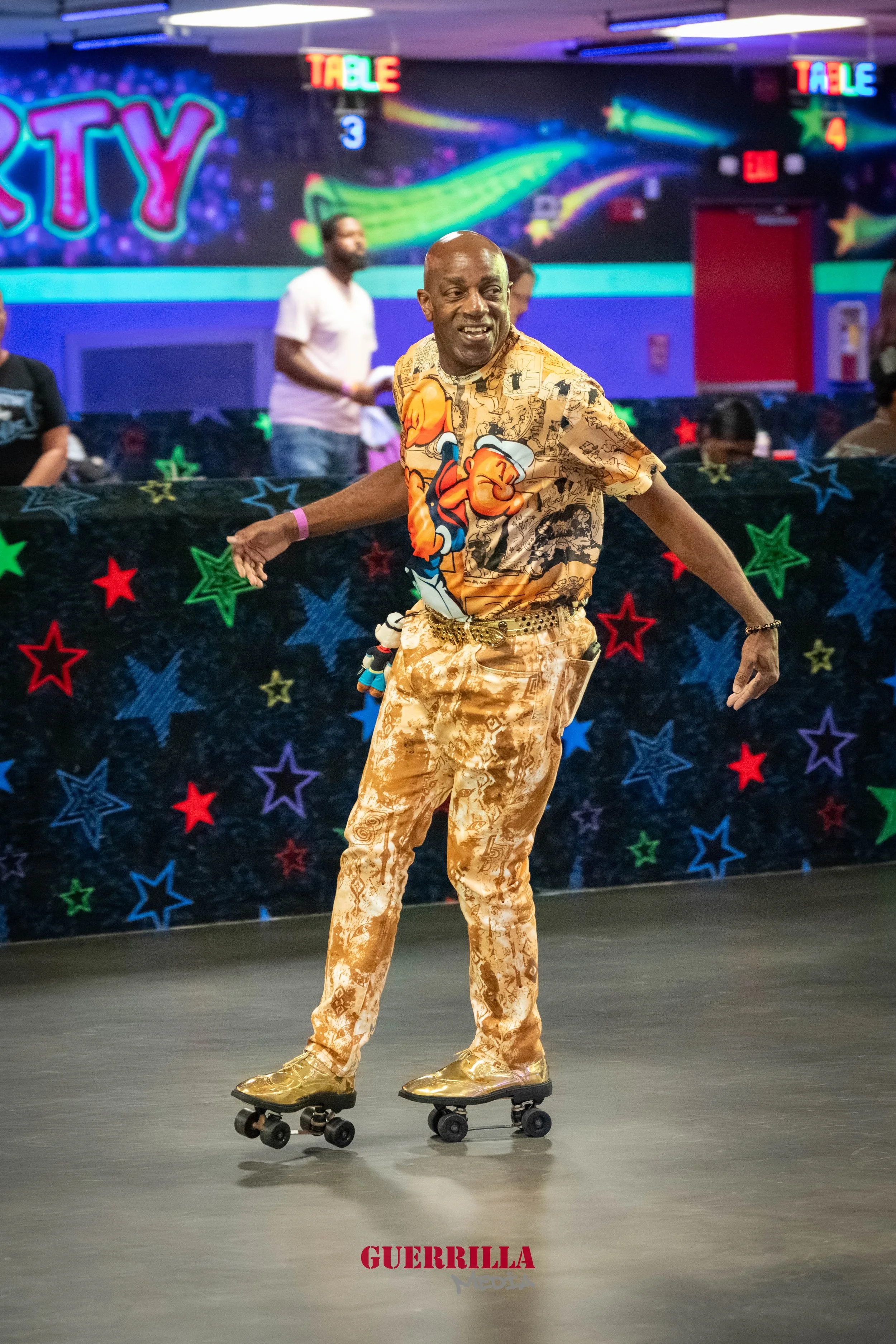 A man roller skating in an indoor arcade with brightly colored neon signs and star-patterned decoration in the background.