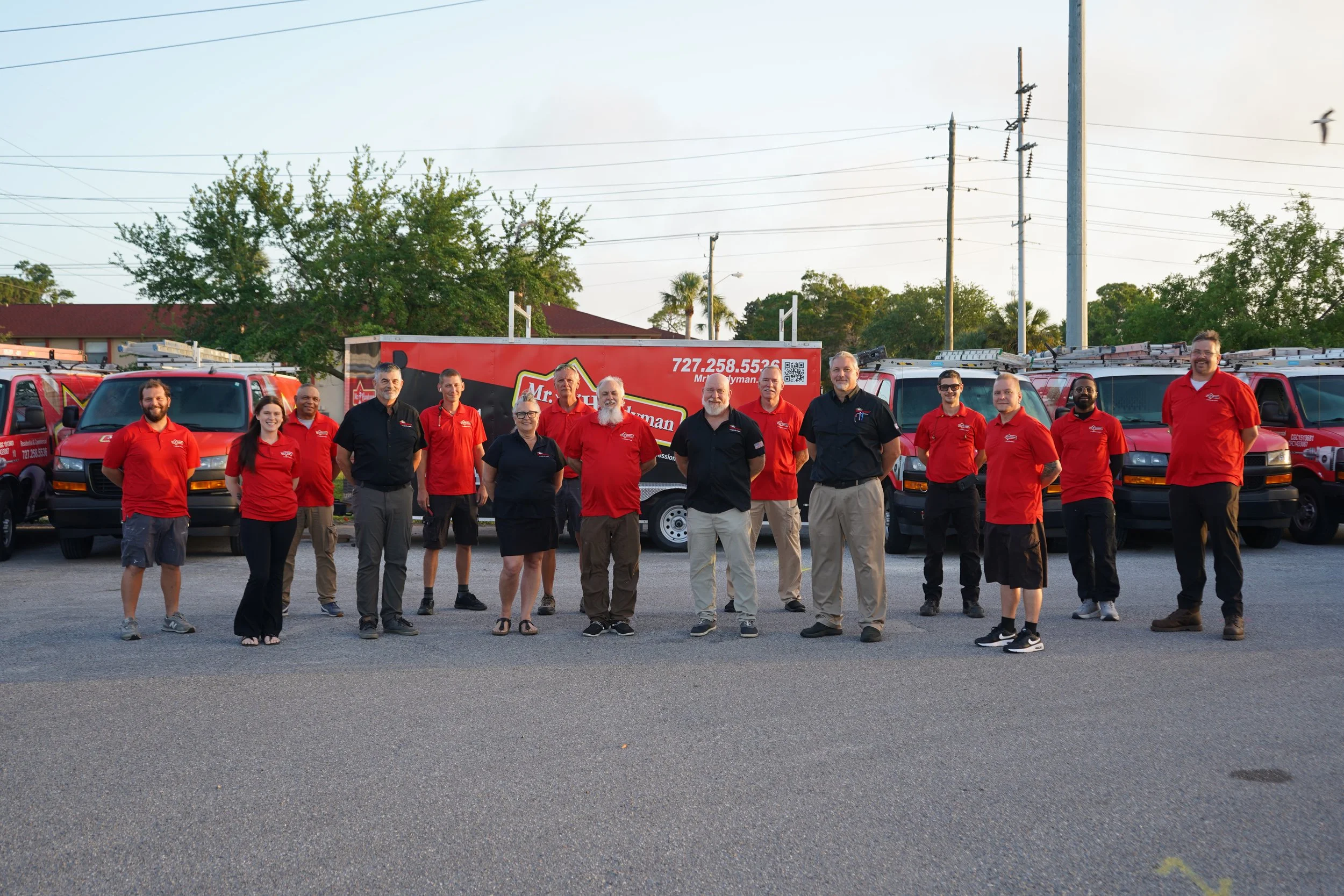 Mr. Handyman Serving Tampa Bay team standing in front of branded service vans – local experts for home repairs, maintenance, and improvement services in Citrus Park, Palm Harbor, Clearwater, Largo, and surrounding areas.
