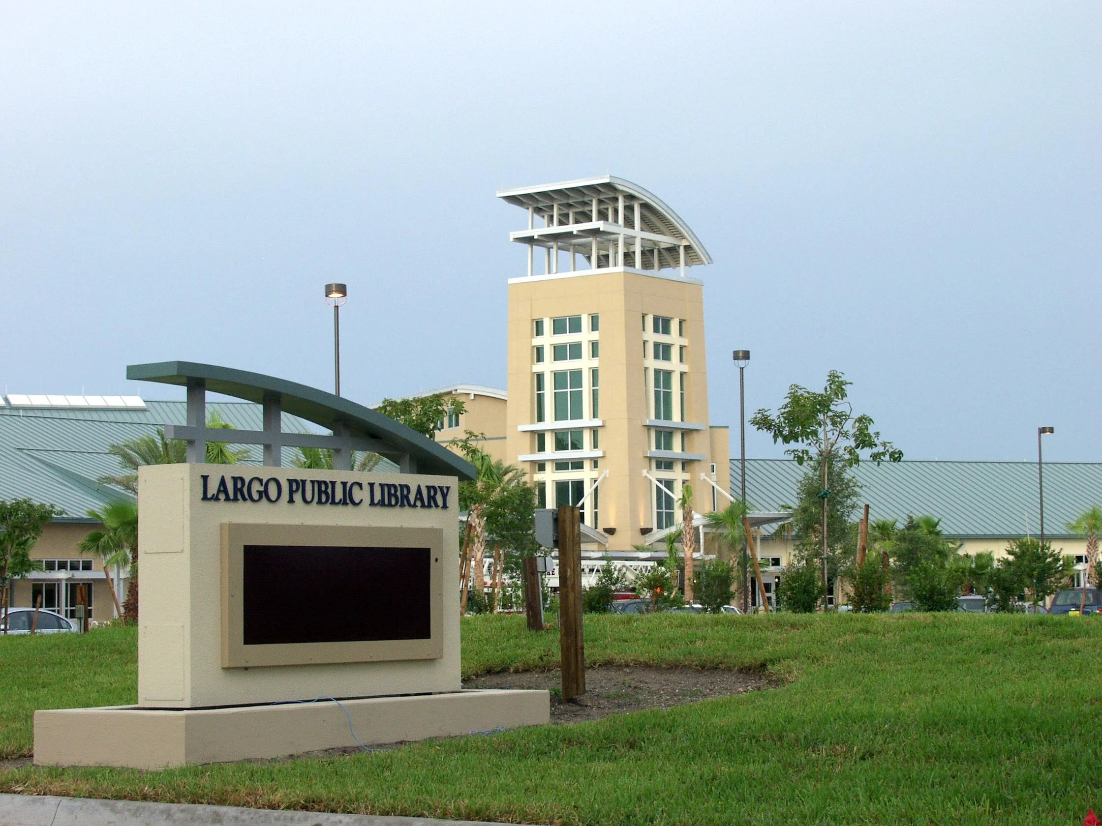 Exterior view of Largo Public Library with modern architecture and lush landscaping