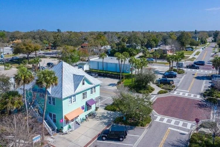 Aerial view of historic downtown Palm Harbor with charming shops and palm-lined streets
