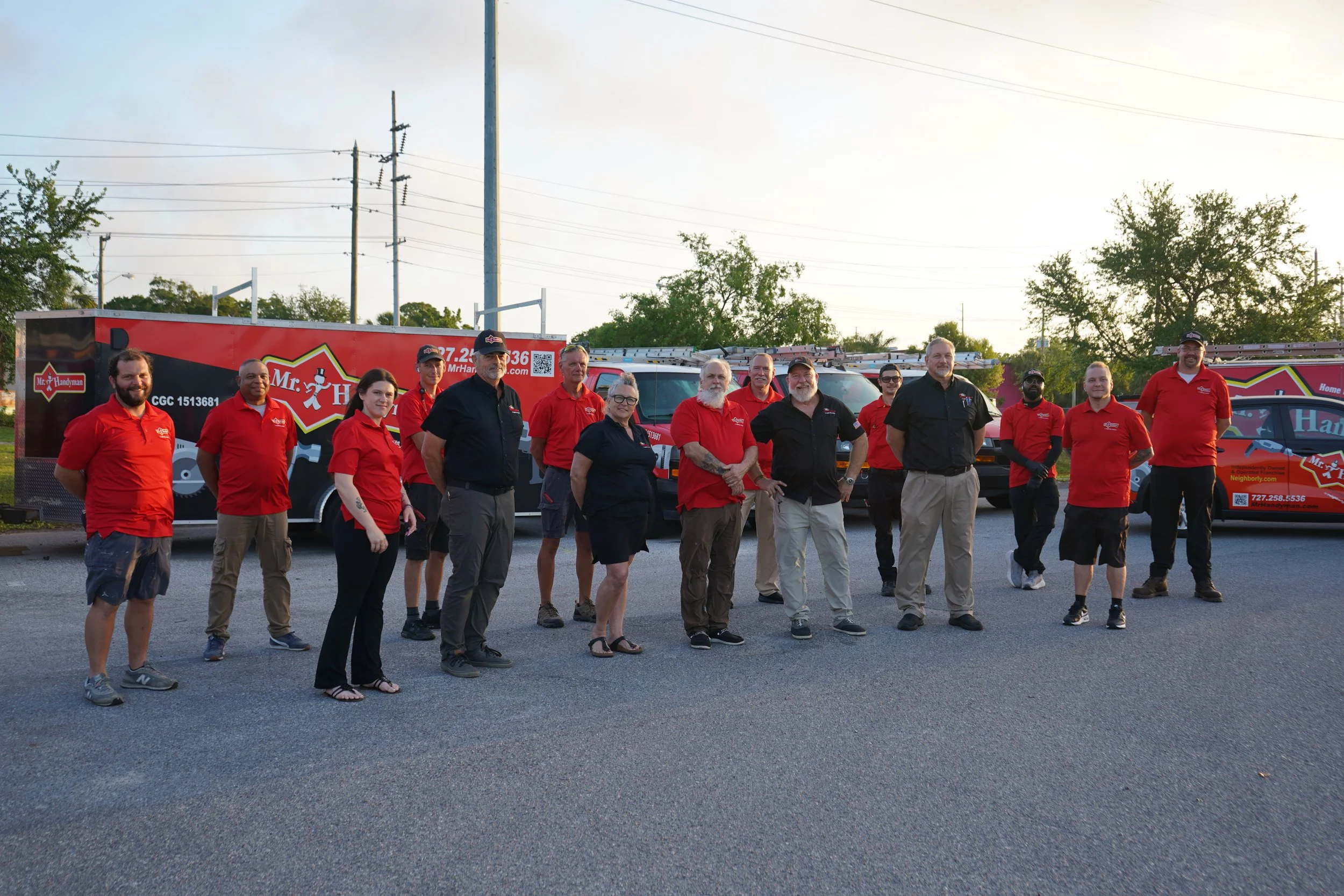 Mr. Handyman of Tampa and Clearwater team standing in front of service vans