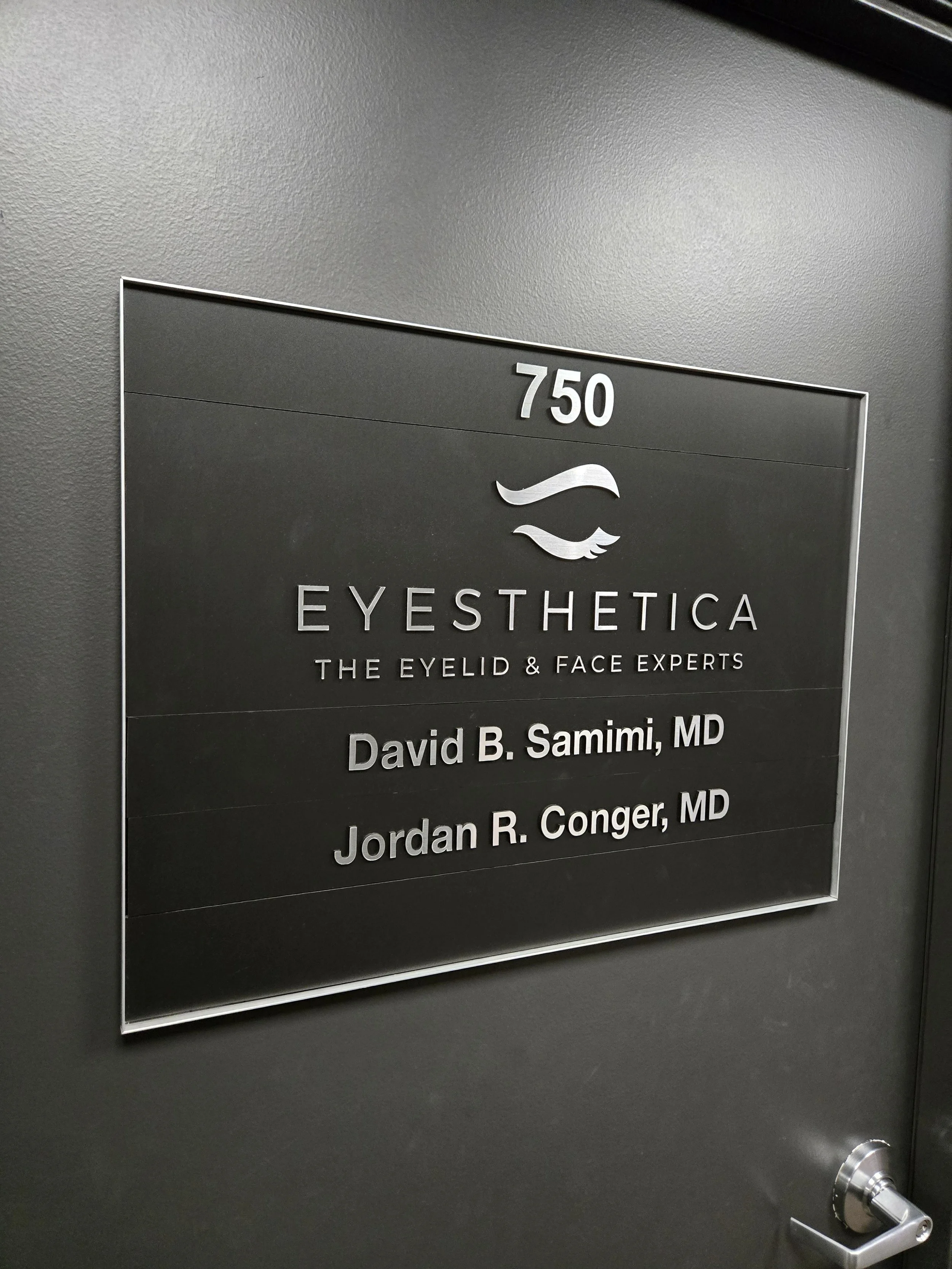 suite directory sign at medical offices with interchangeable magnetic inserts