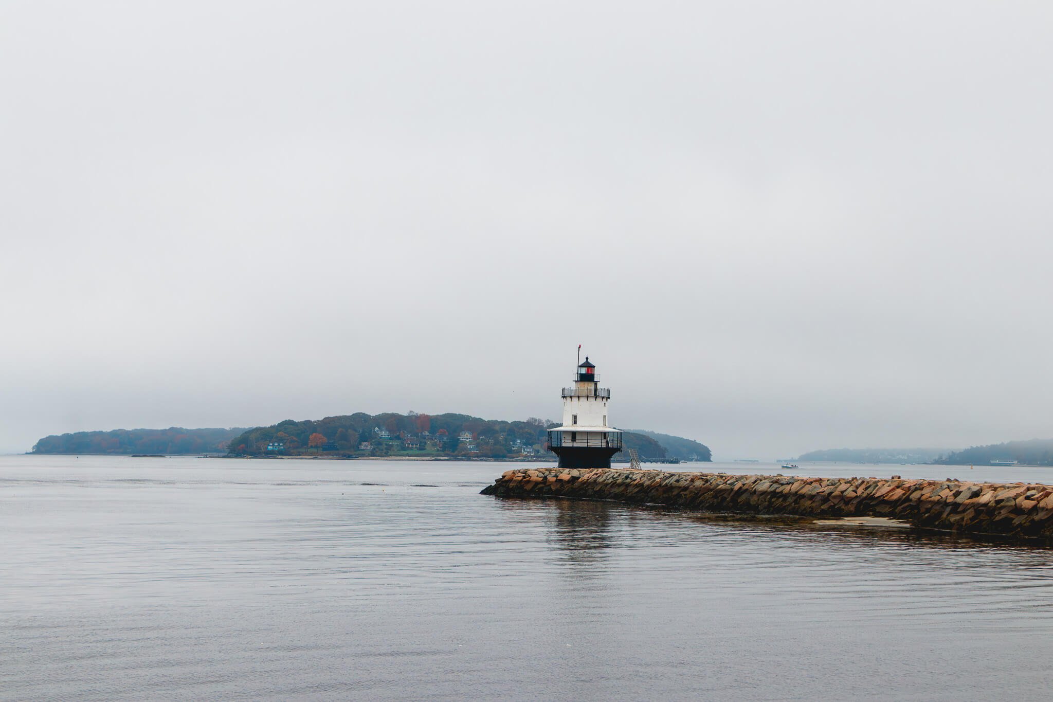 Spring Point Ledge Lighthouse on a stone breakwater in Portland, Maine