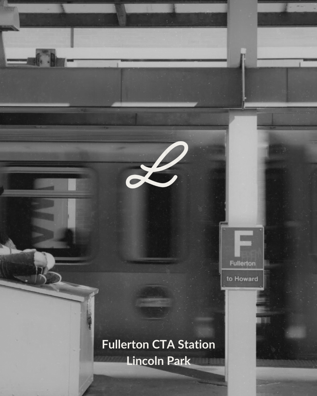 Black and white photo of a subway train at Fullerton CTA Station in Lincoln Park, with a large cursive letter 'L' sticker on the train window, and a sign indicating the train F to Howard.