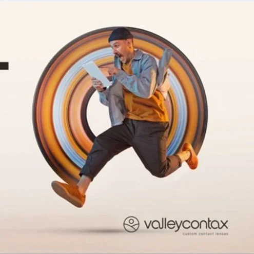 A man appears to be jumping in front of a large rolling element, holding a tablet, with the Valley Contax logo and text below.