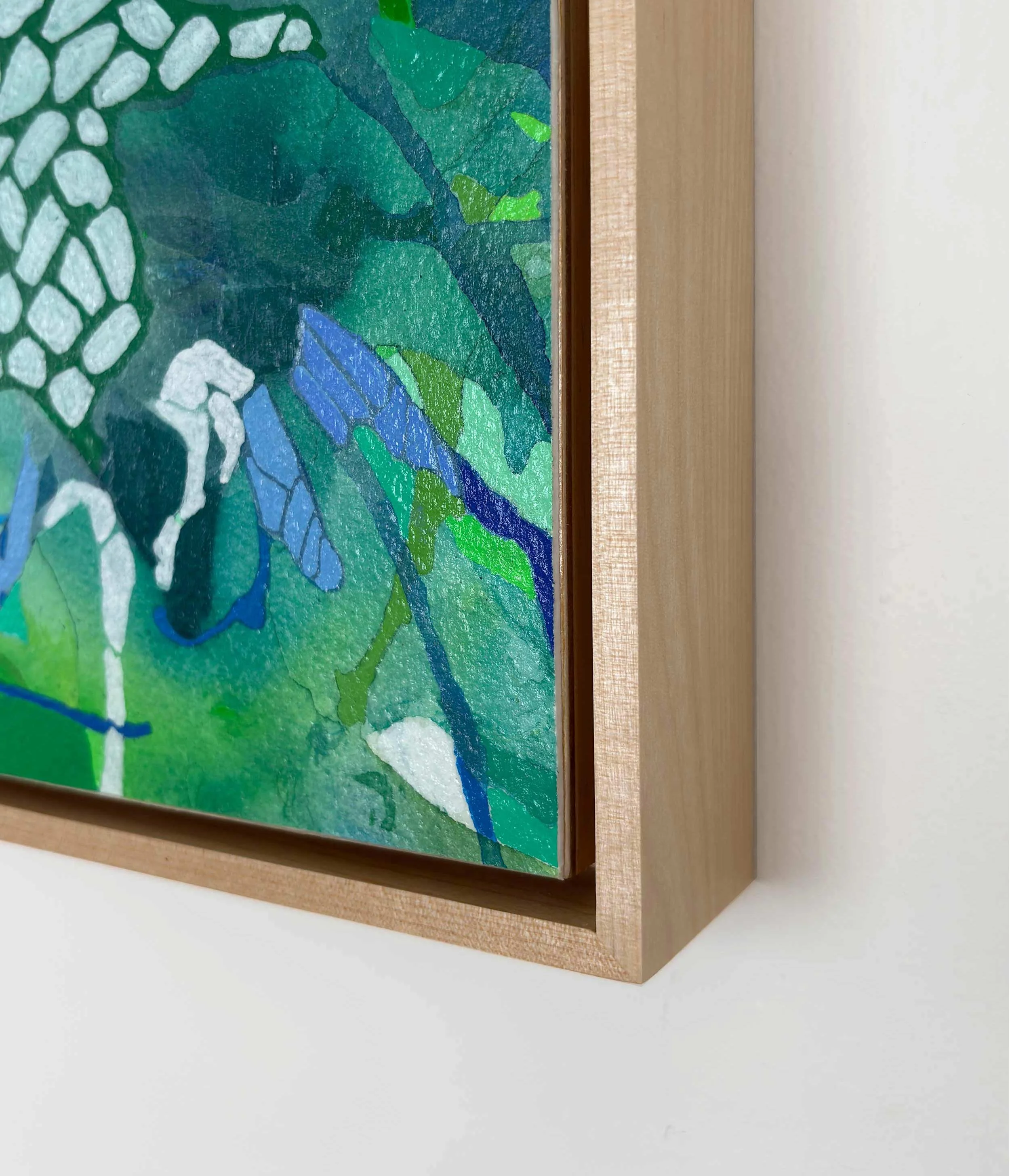 Corner detail of “Surroundings” by Calie Durant, framed in light maple wood, highlighting texture and craftsmanship.