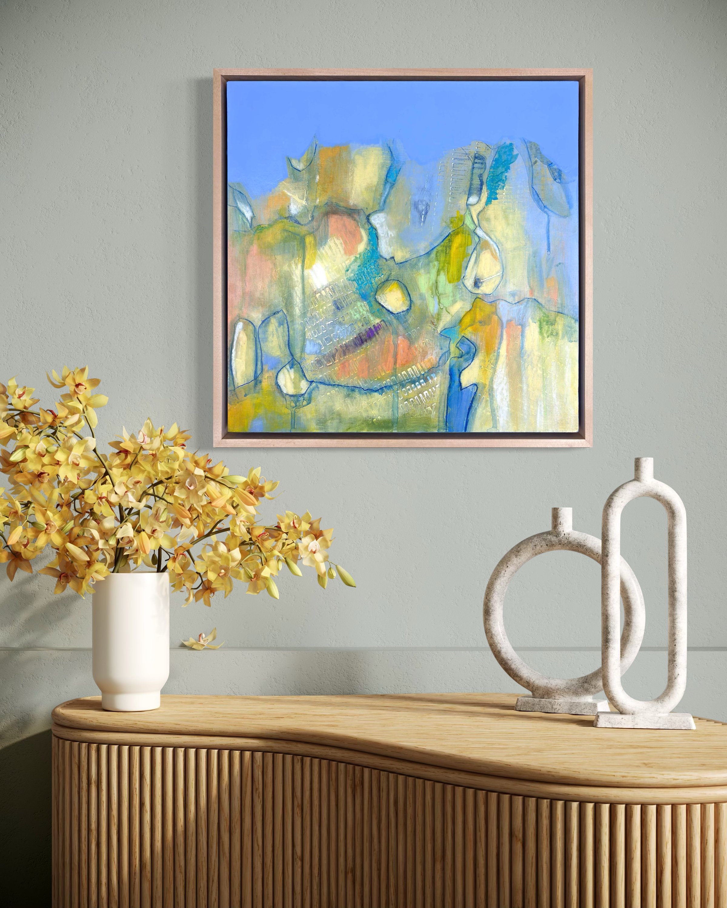 Abstract painting “Echoes of Light II” by Calie Durant displayed on a living room wall, showing scale and presence within a modern interior.