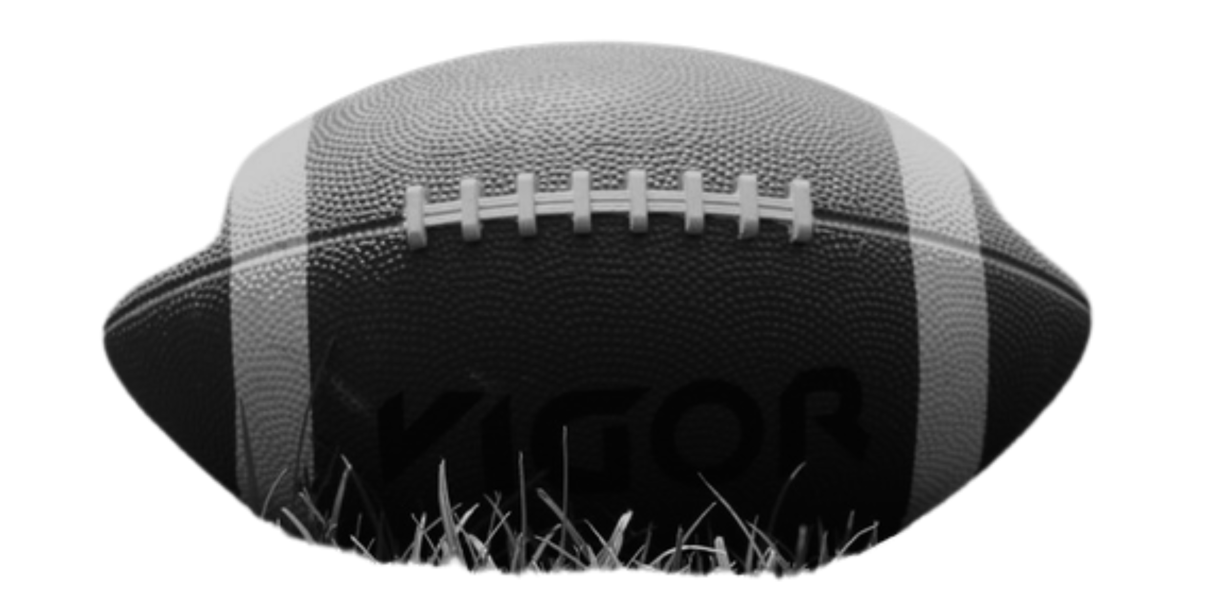 Close-up of an American football on grass with visible stitching and branding.