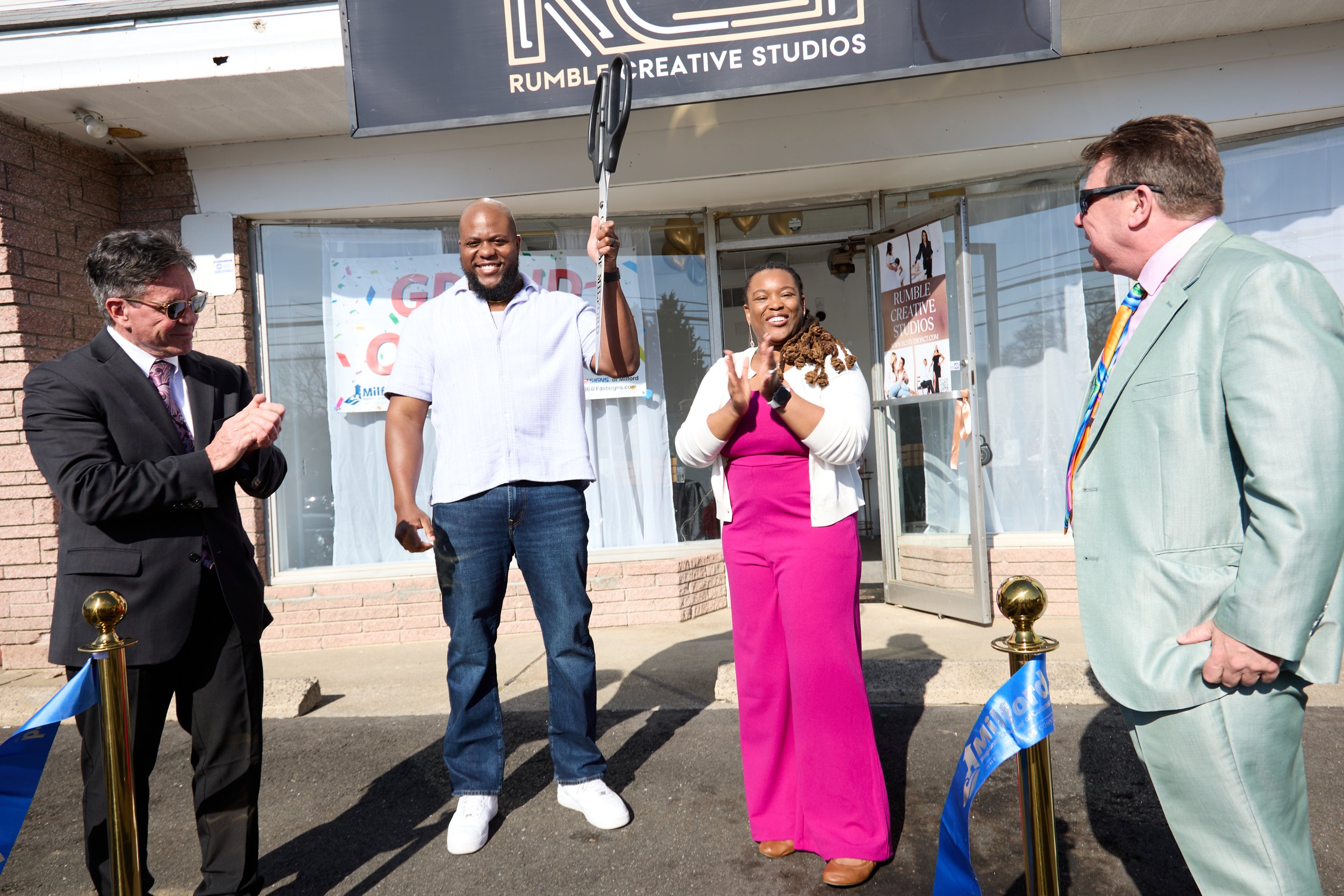 Mayor Richard Smith joins co-founders Brad Rumble and Karena Rumble-Carter at the official Rumble Creative Studios ribbon cutting ceremony in Milford, CT.