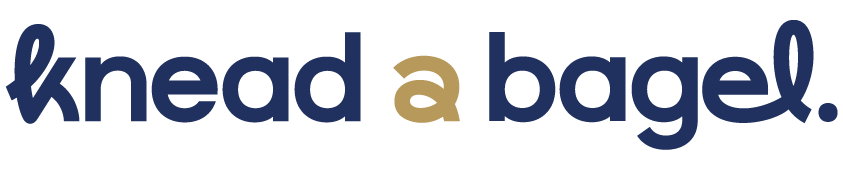 Text graphic with the words "knead a bagel" in dark blue and beige colors.