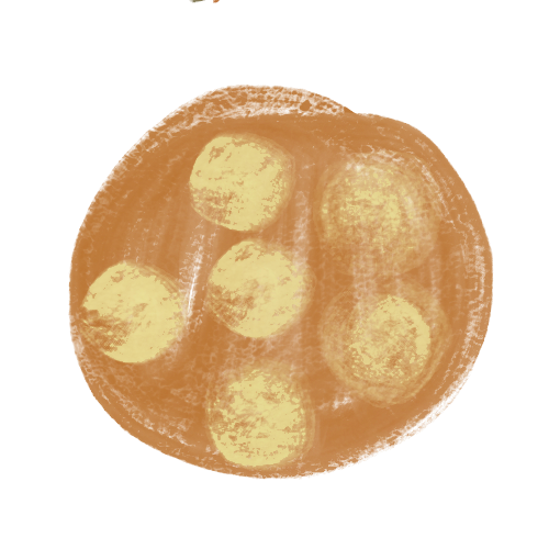 Six round cheese balls arranged on a plate with a dip or sauce.