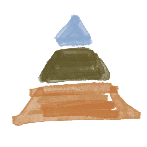 A person riding a motorcycle on a road in a scenic outdoor area with mountains and trees.