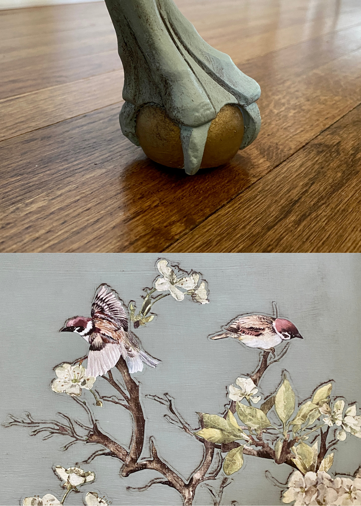 Close-up of a skeletal bird sculpture standing on a wooden floor and a painting of birds and flowers in the background.