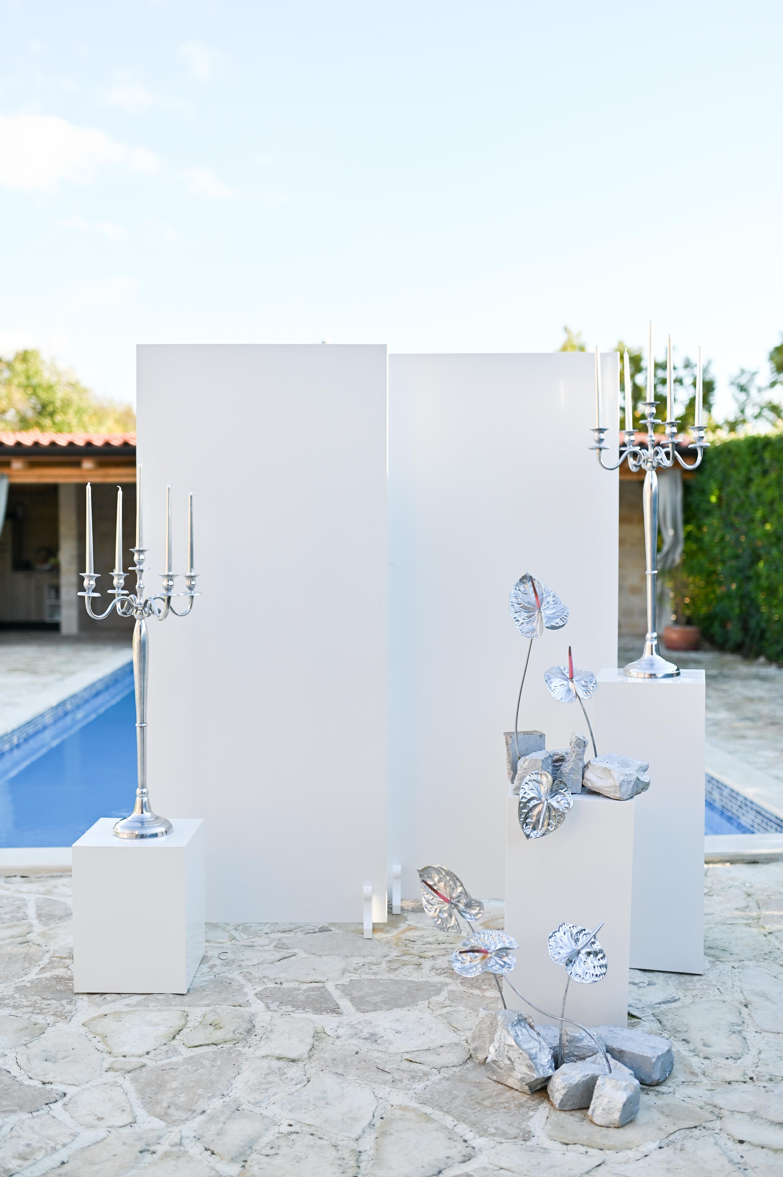 luxury event décor setup with candelabras by pool in Croatia