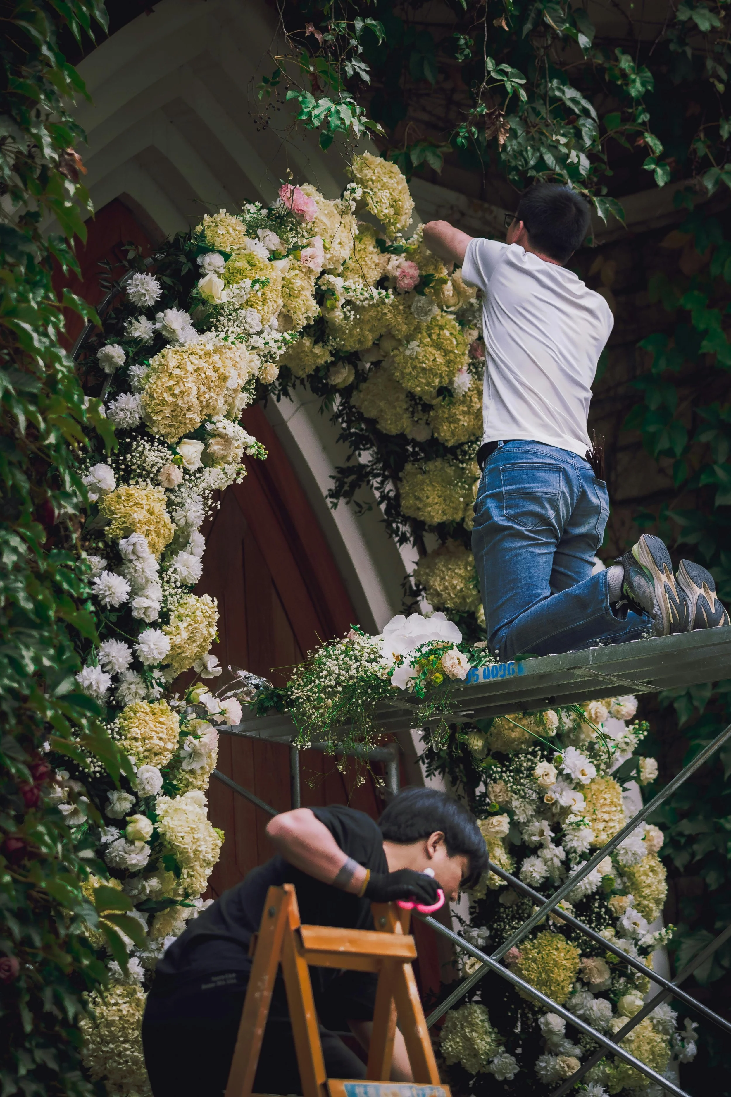 event decorator creating floral installation for wedding in Croatia