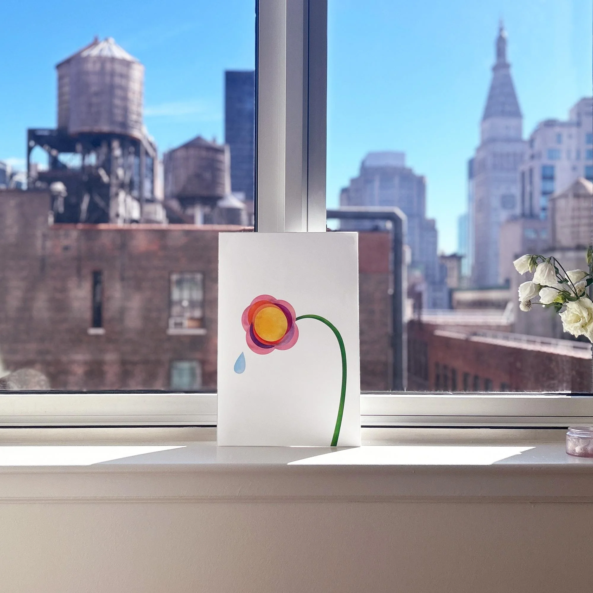 Weeping Tulip art print propped against the window on a sunny NYC day. From the Wanderer collection.