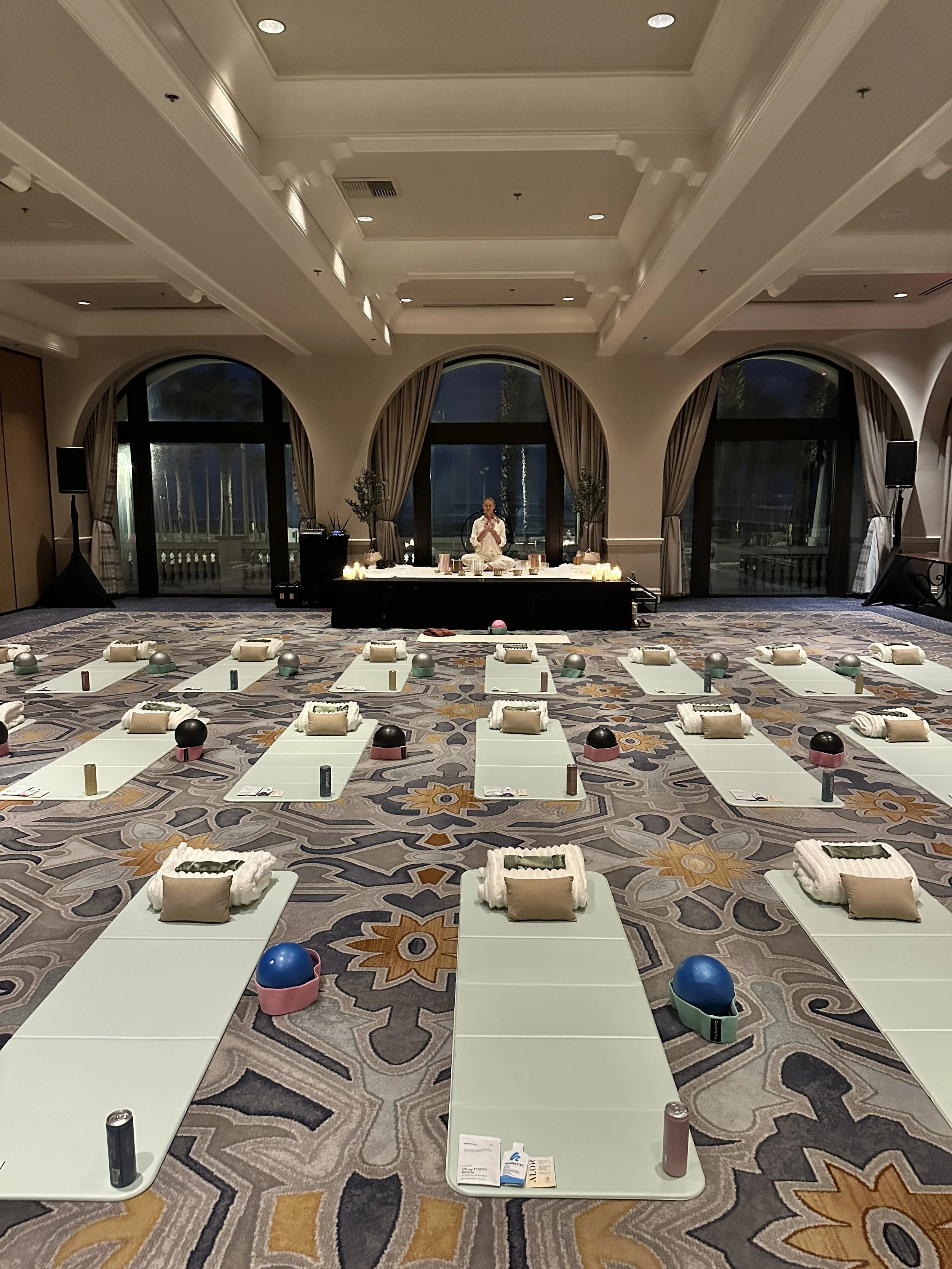 Gwen Gaydos facilitating an immersive sound bath experience for corporate wellness and nervous system relaxation.