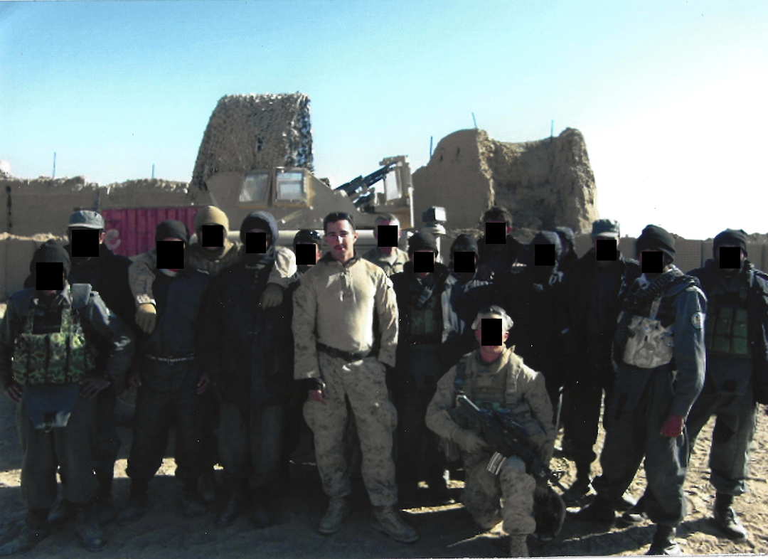 An image of Will and the Afghan National Police he trained in 2008