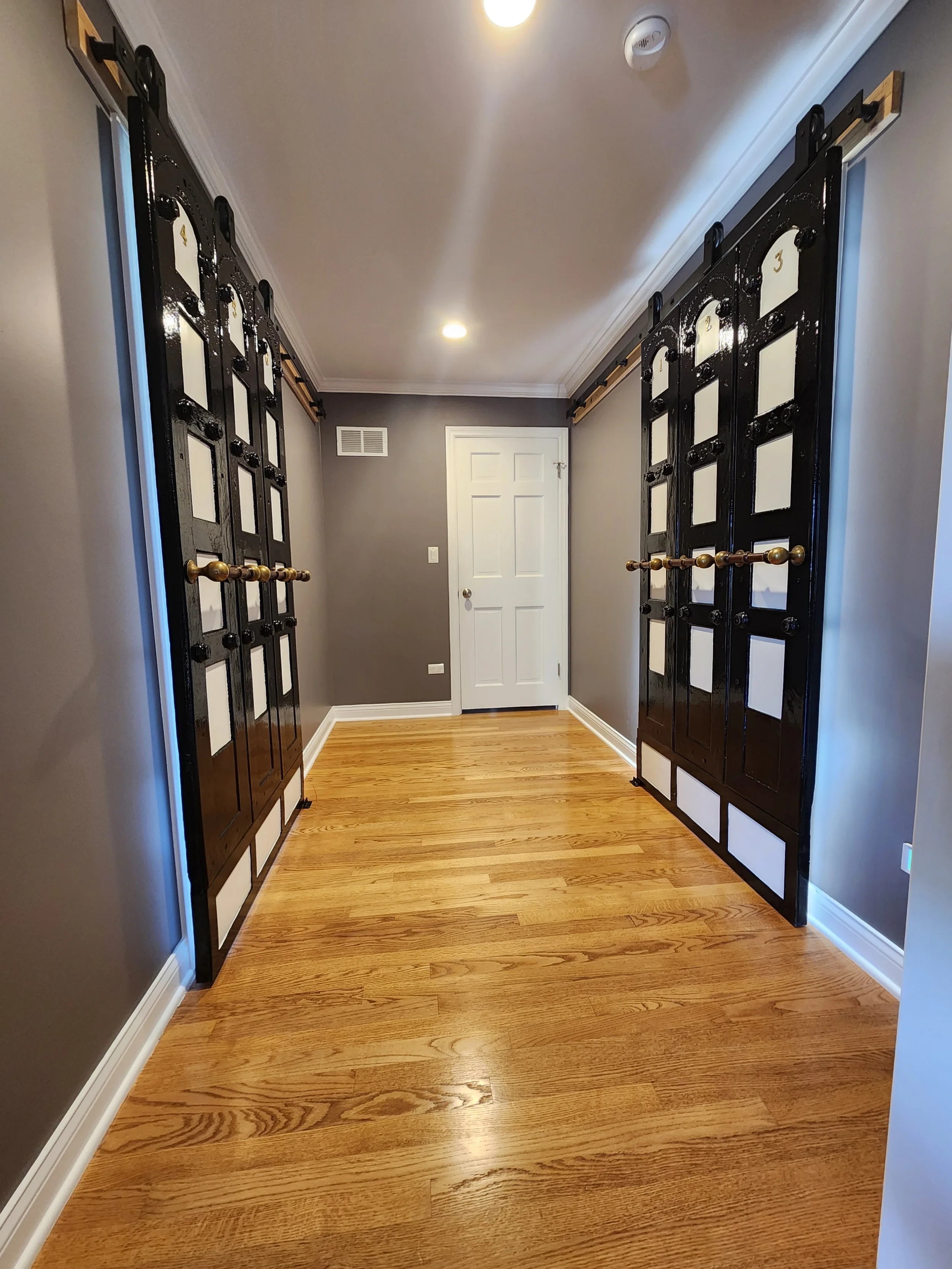 "Custom black barn door painting and professional interior restoration by Kora Pro Painting in Des Plaines and the Chicago West Suburbs."