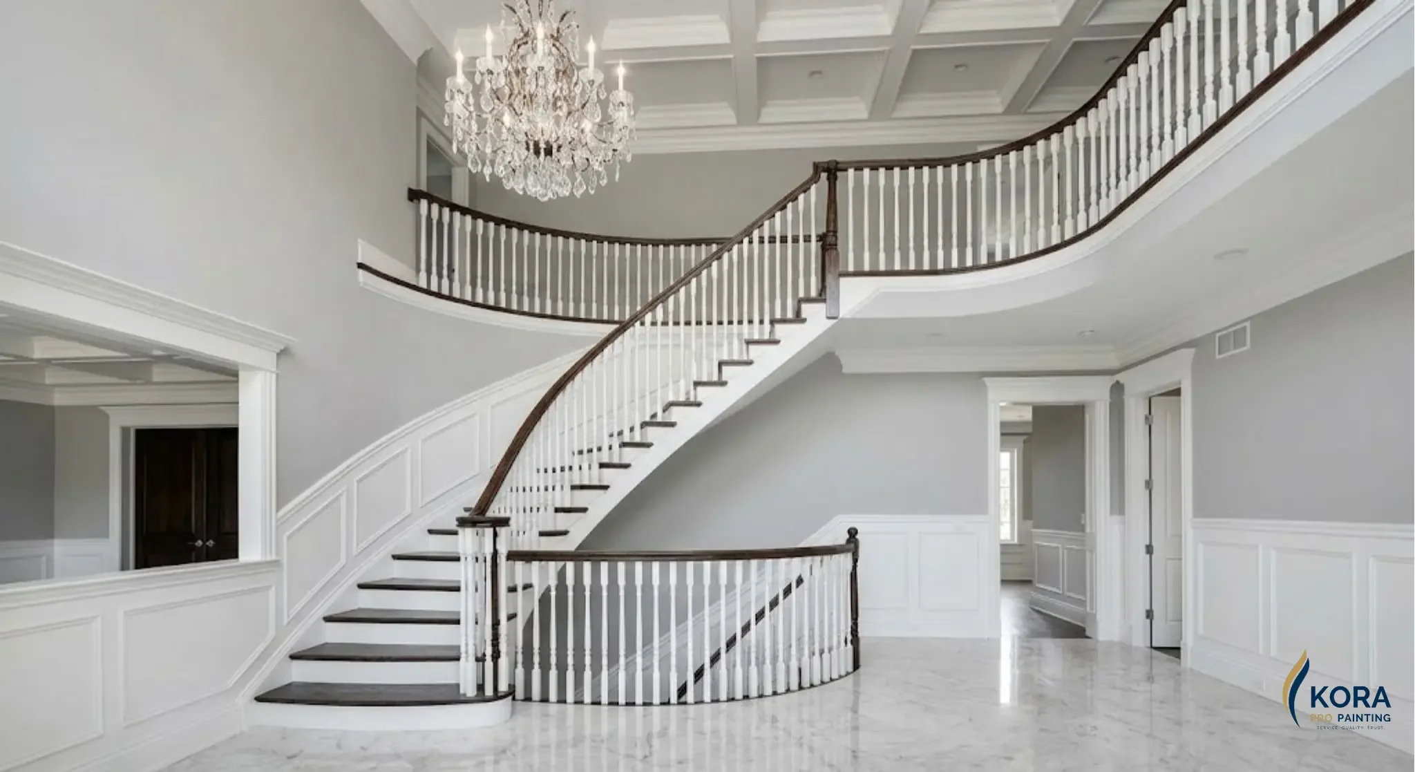 High-end residential interior painting of a double-height foyer and staircase in a Schaumburg estate by Kora Pro Painting.