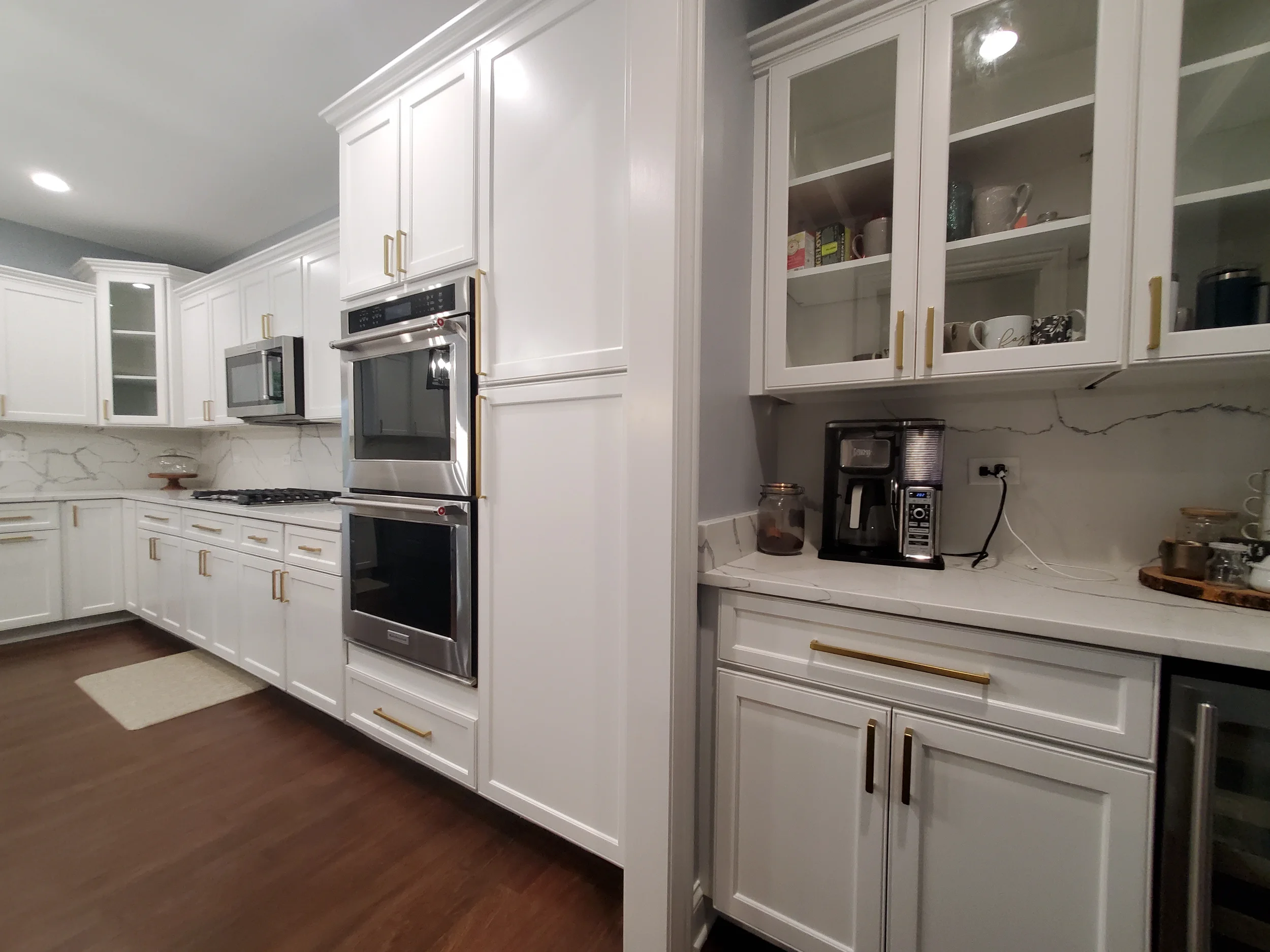 "Premium white kitchen cabinet refinishing project by Kora Pro Painting in Naperville and St. Charles, IL, featuring factory-grade coatings."