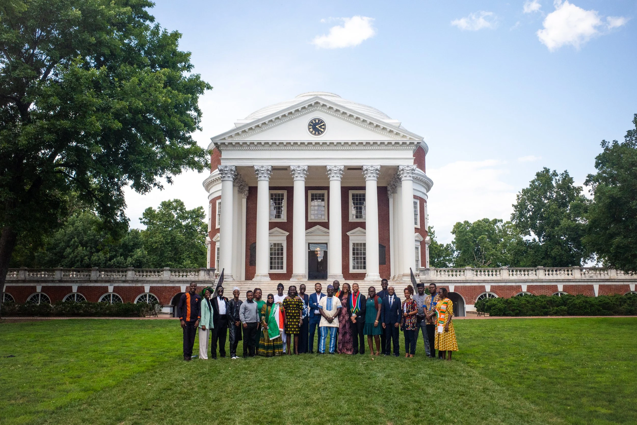 group of young adults from africa standing in front of the rotunda at the university of virginia