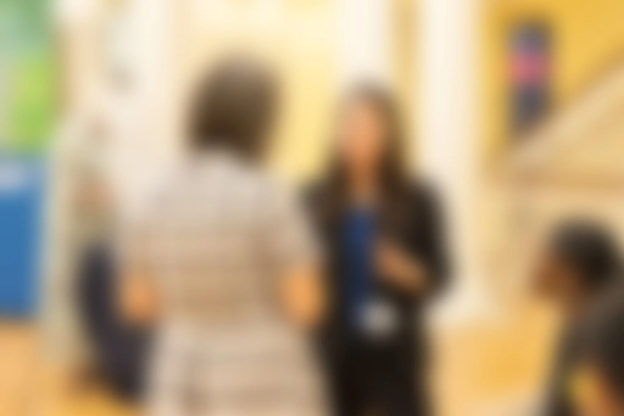 blurry photo of two people talking