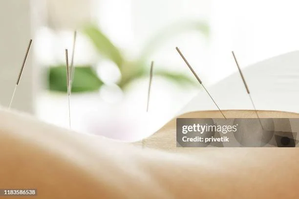 integrative medicine doctor writing in notebook
