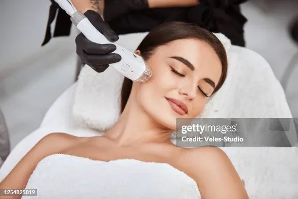 Close-up of white blossoms on a tree branch with a blurred background.