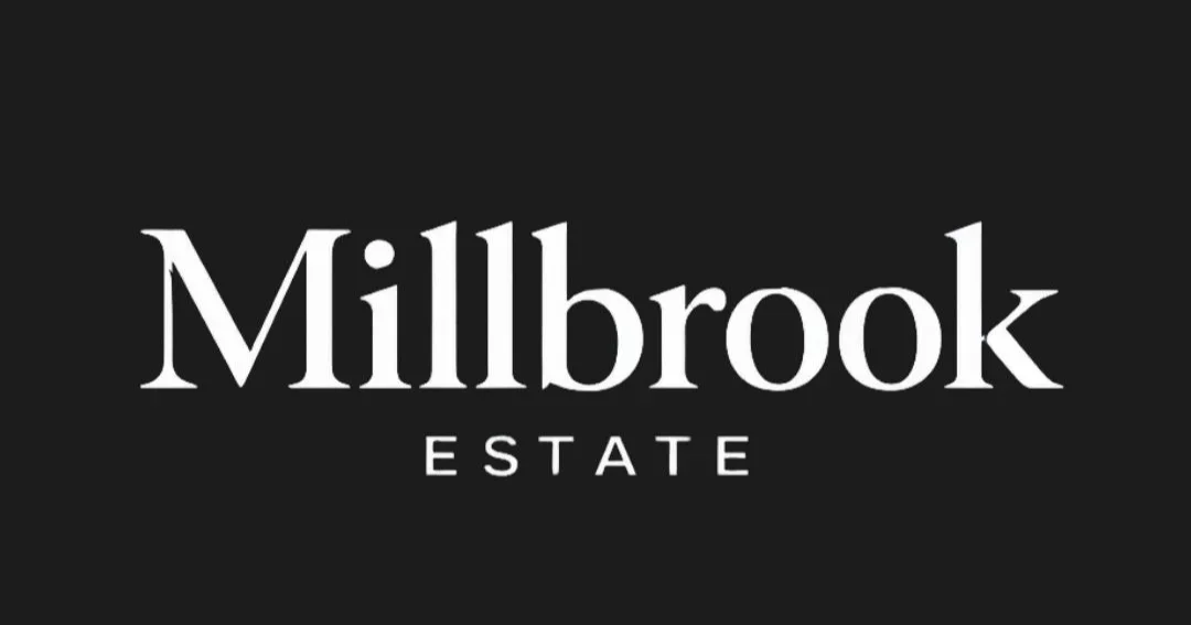 Millbrook Estate logo in white text on a black background.