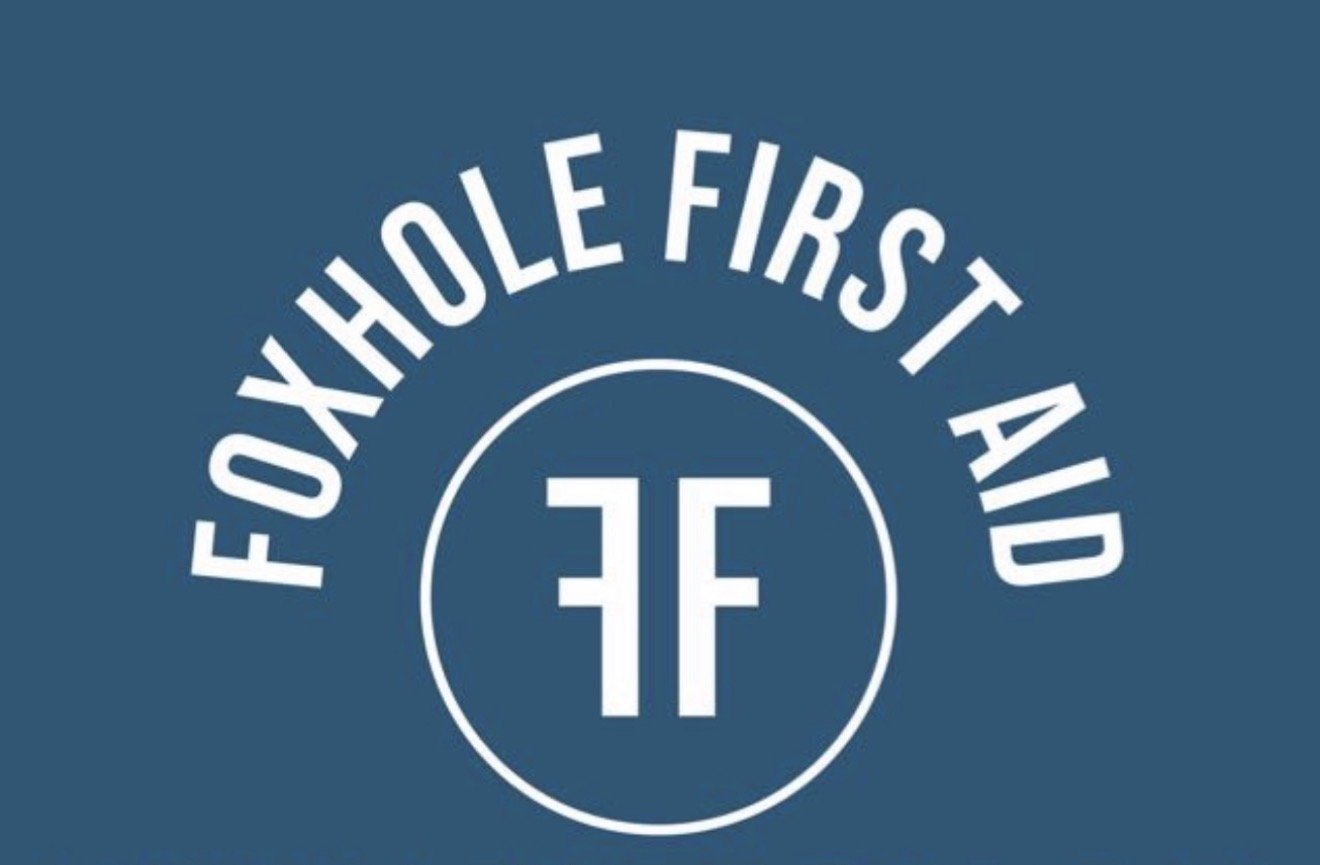 Logo with the text 'Foxhole First Aid' and a stylized 'FF' in the center on a blue background.