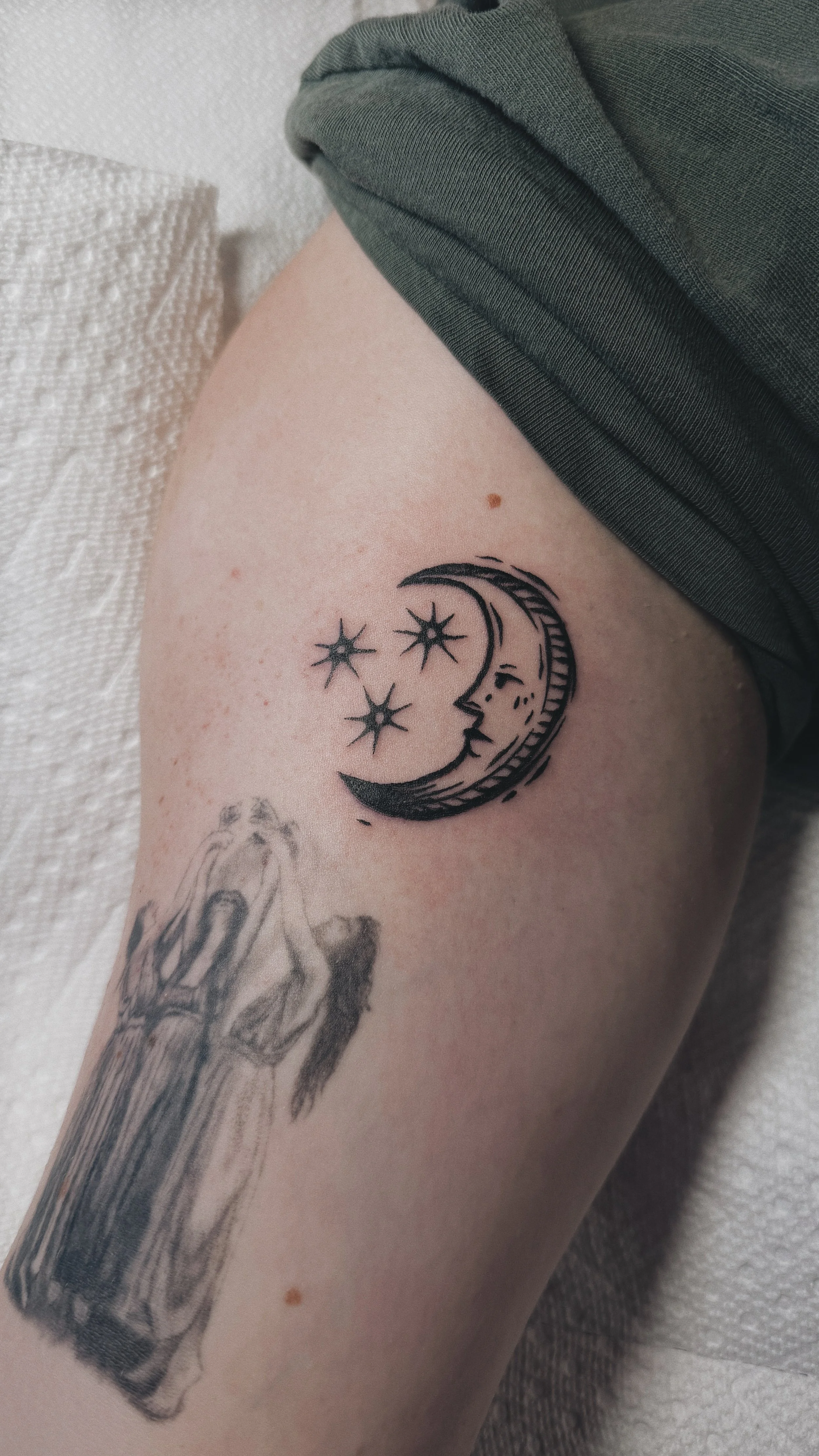 linocut inkblot medieval blackwork linework tattoo moon with face and stars