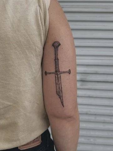 dotwork tattoo of the blade of anduril from lord of the rings broken sword