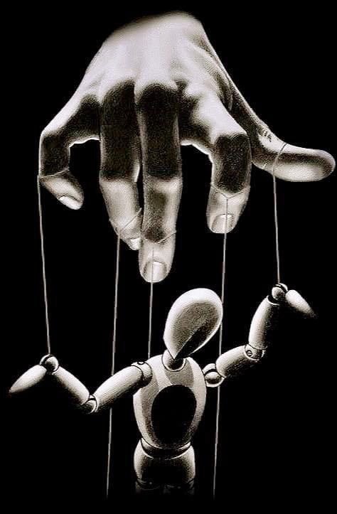 A human hand controlling a wooden puppet with strings, resembling a puppeteer manipulating a marionette.