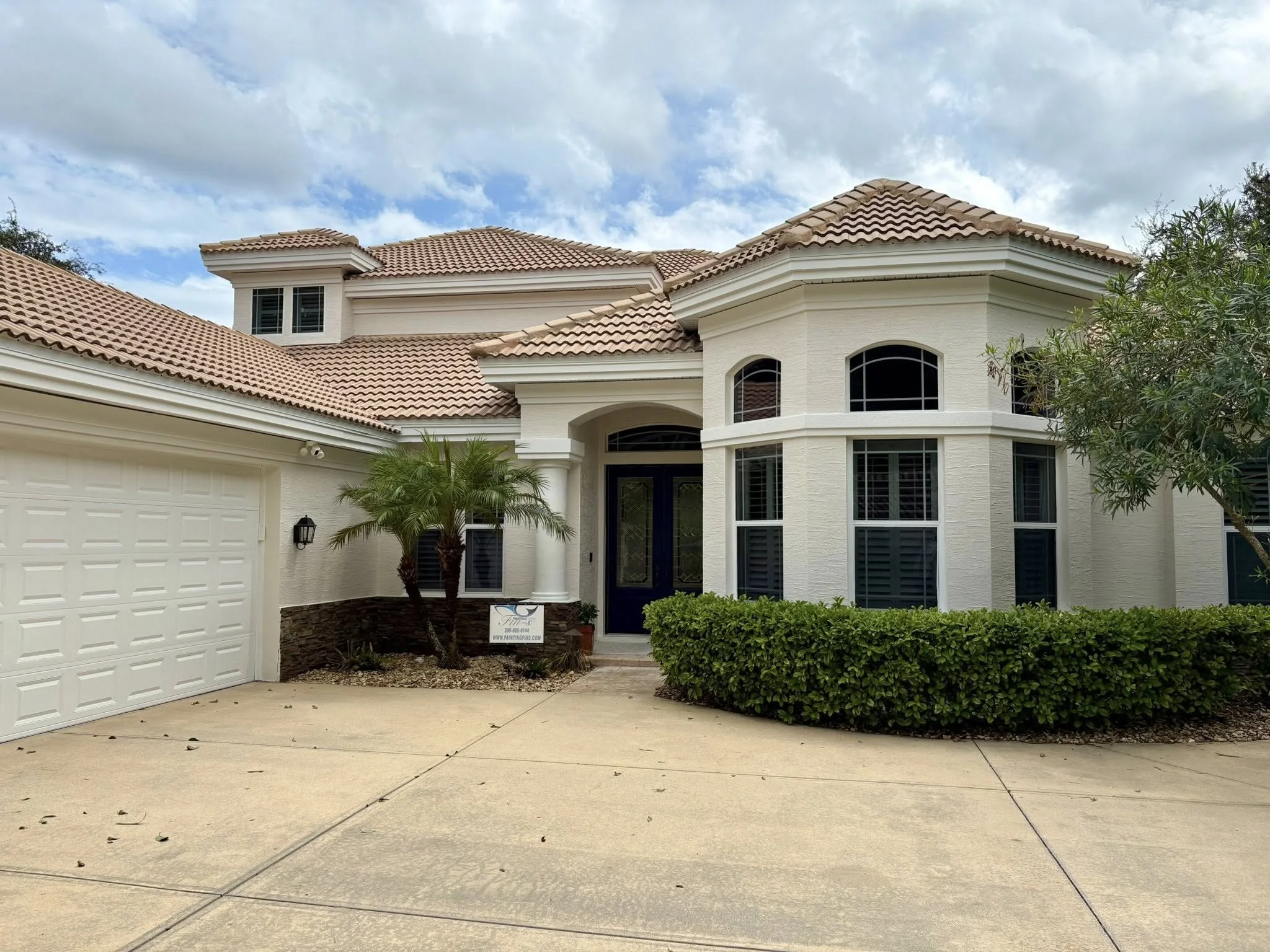 After: exterior wall repaint with even coverage and clean finish.