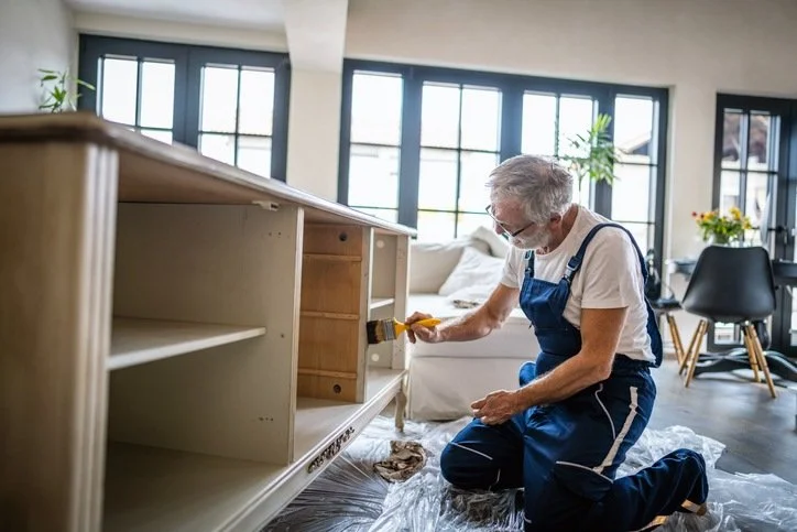Professional refinishing wooden cabinets in a residential kitchen in Palm Coast, FL