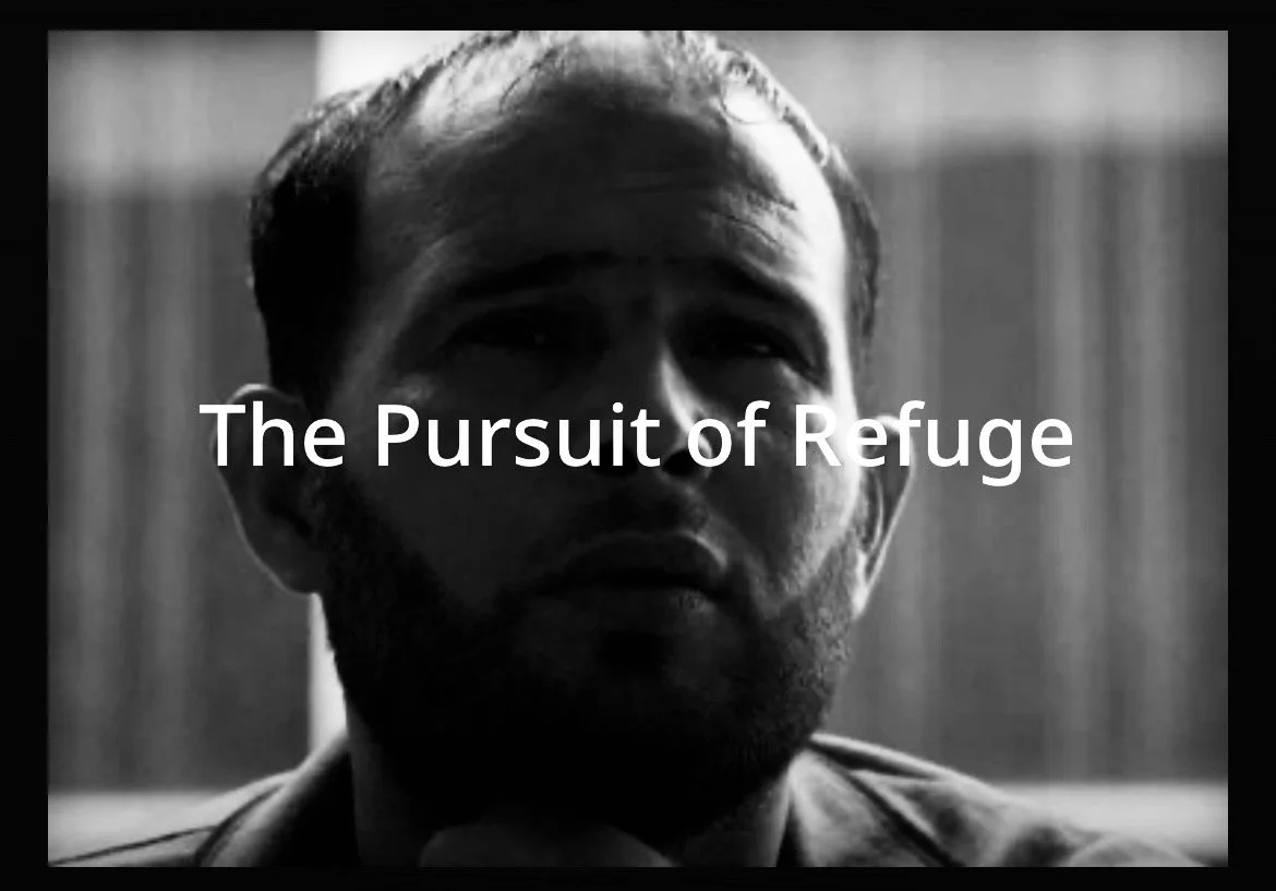Black and white photo of a man with a beard, looking serious, with the text "The Pursuit of Refuge" overlaid.