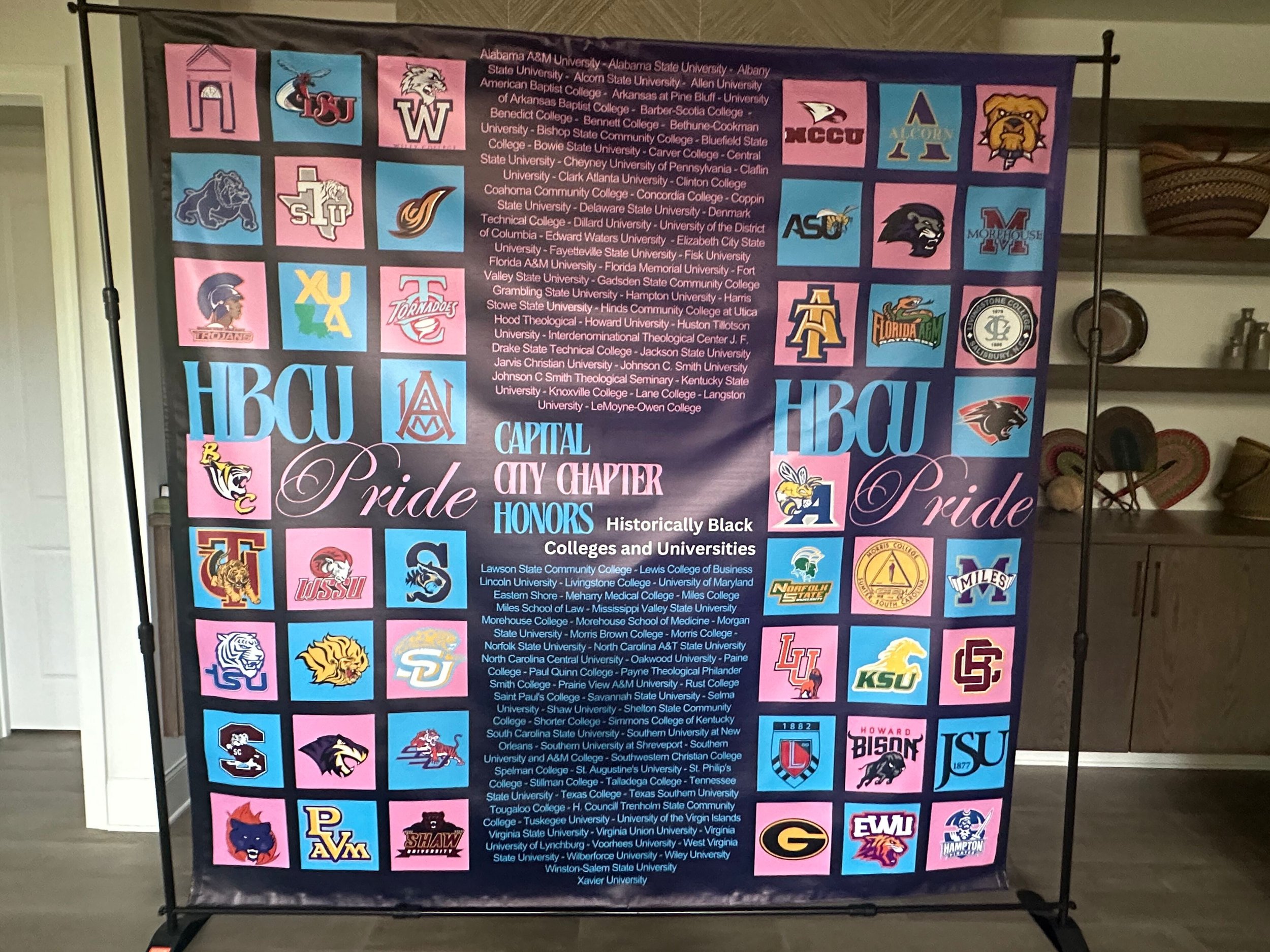 A college pride banner displaying logos, names, and acronyms of various universities, with the words 'Pride,' 'Honor,' and 'HCW' prominently featured, along with a list of colleges and universities.