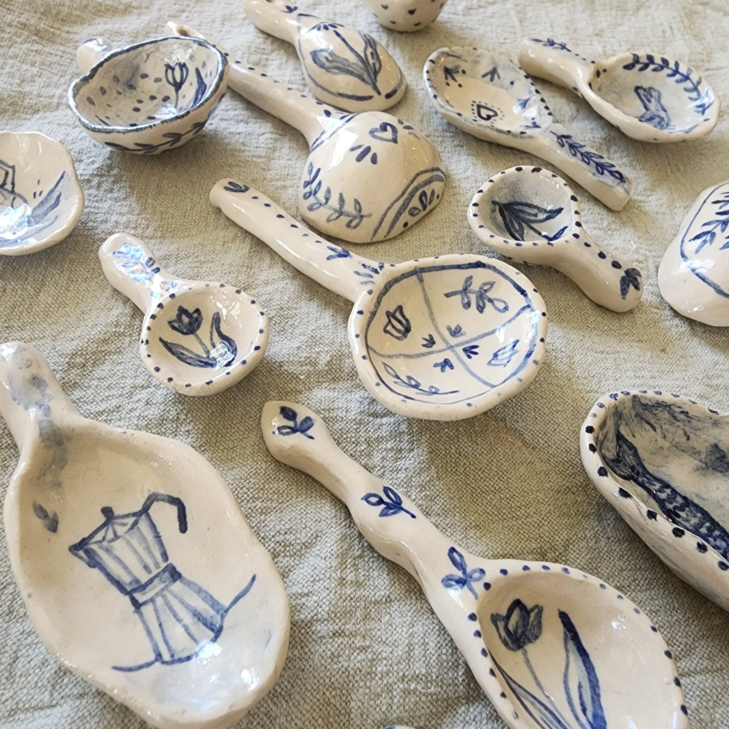 Ceramic spoons  - Can be used functionally, for example as a salt spoon, or hung as decor. All spoons have designs on both sides. 

Dishwasher safe. 

Price: All priced between £15-20 depending on size and design, plus shipping (and taxes if outside 