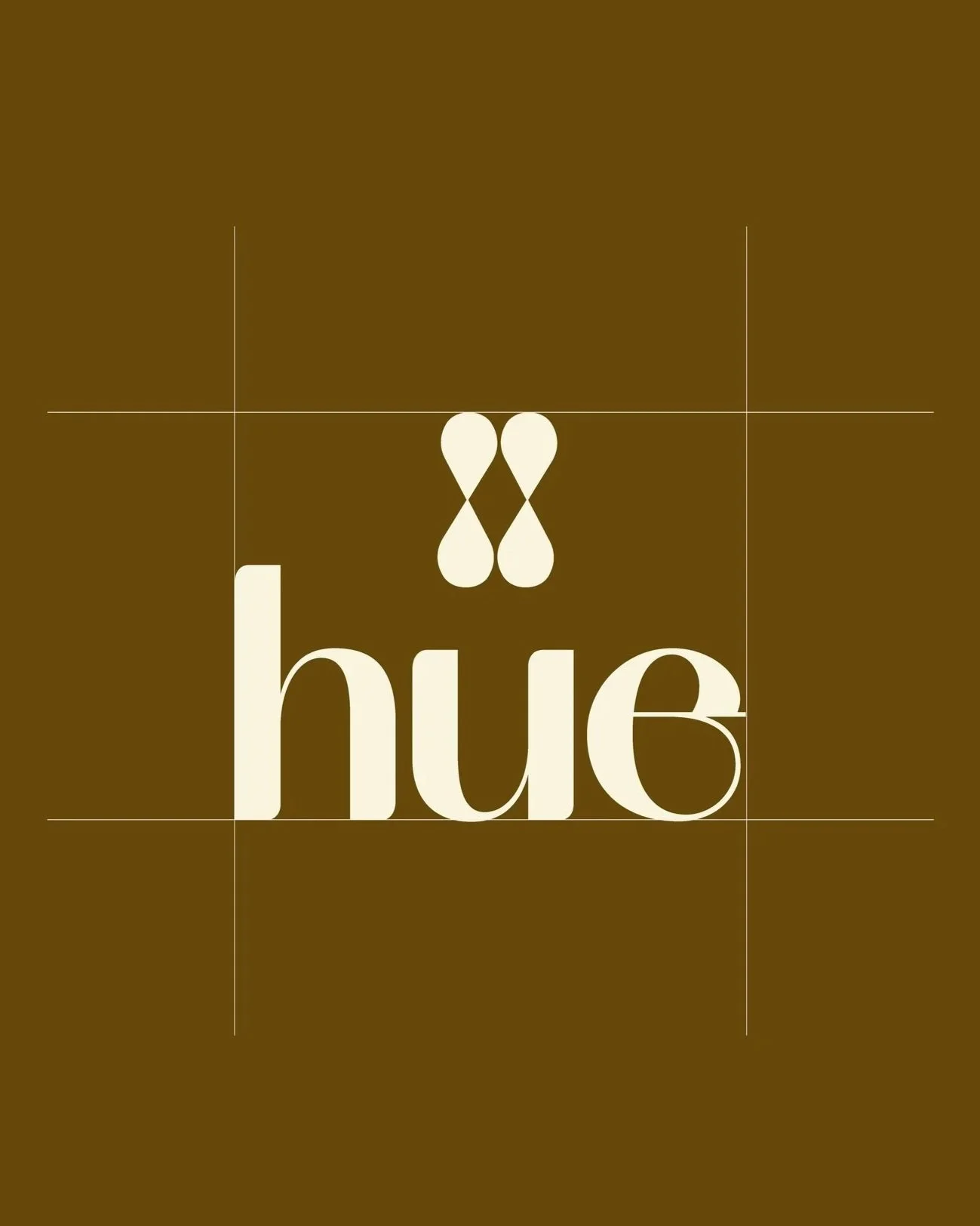 A logo with a brown background and the word 'hue' in lowercase, cream-colored letters. Above the word, there are two stylized cream-colored shapes resembling a nose and nose bridge.