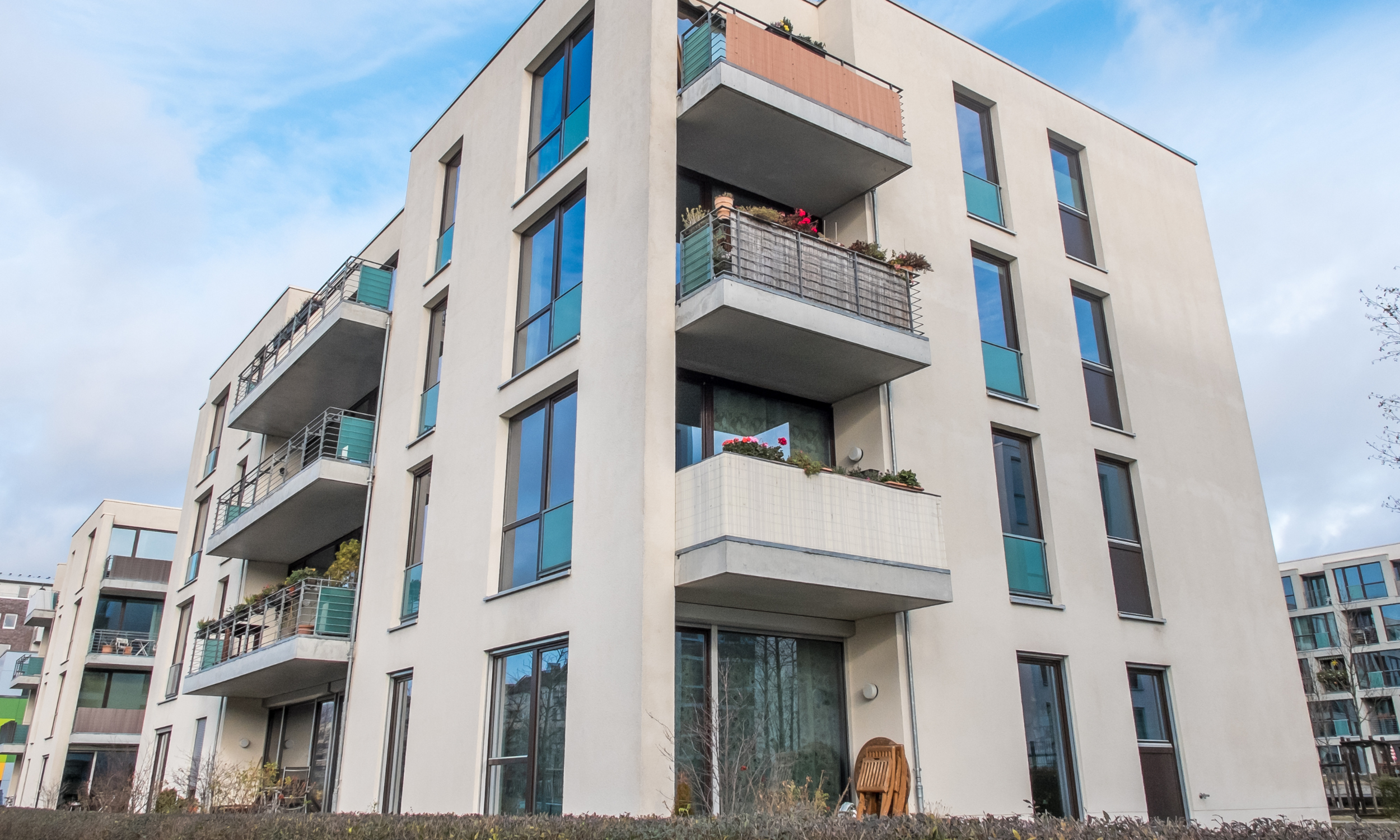 Low-rise residential apartment building with balconies, the type of block affected by new Cladding Safety Scheme funding for buildings under 11 metres