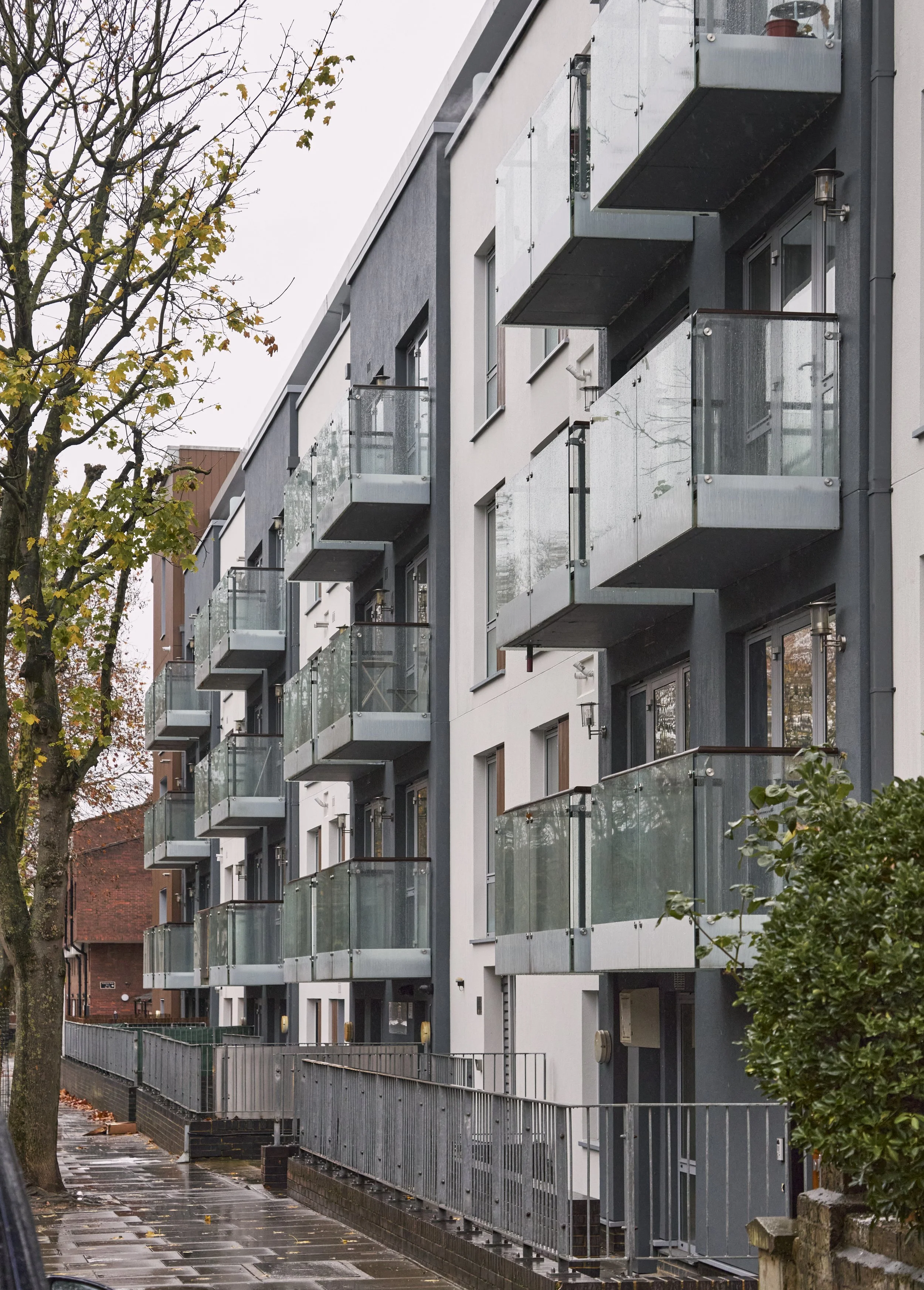 Kinver House, Islington apartment building with glass balconies following cladding remediation works.