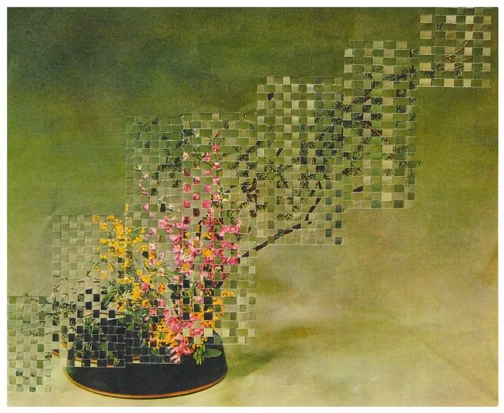 A floral arrangement in a black vase with pink, yellow, and green flowers, partially pixelated with a checkered overlay.