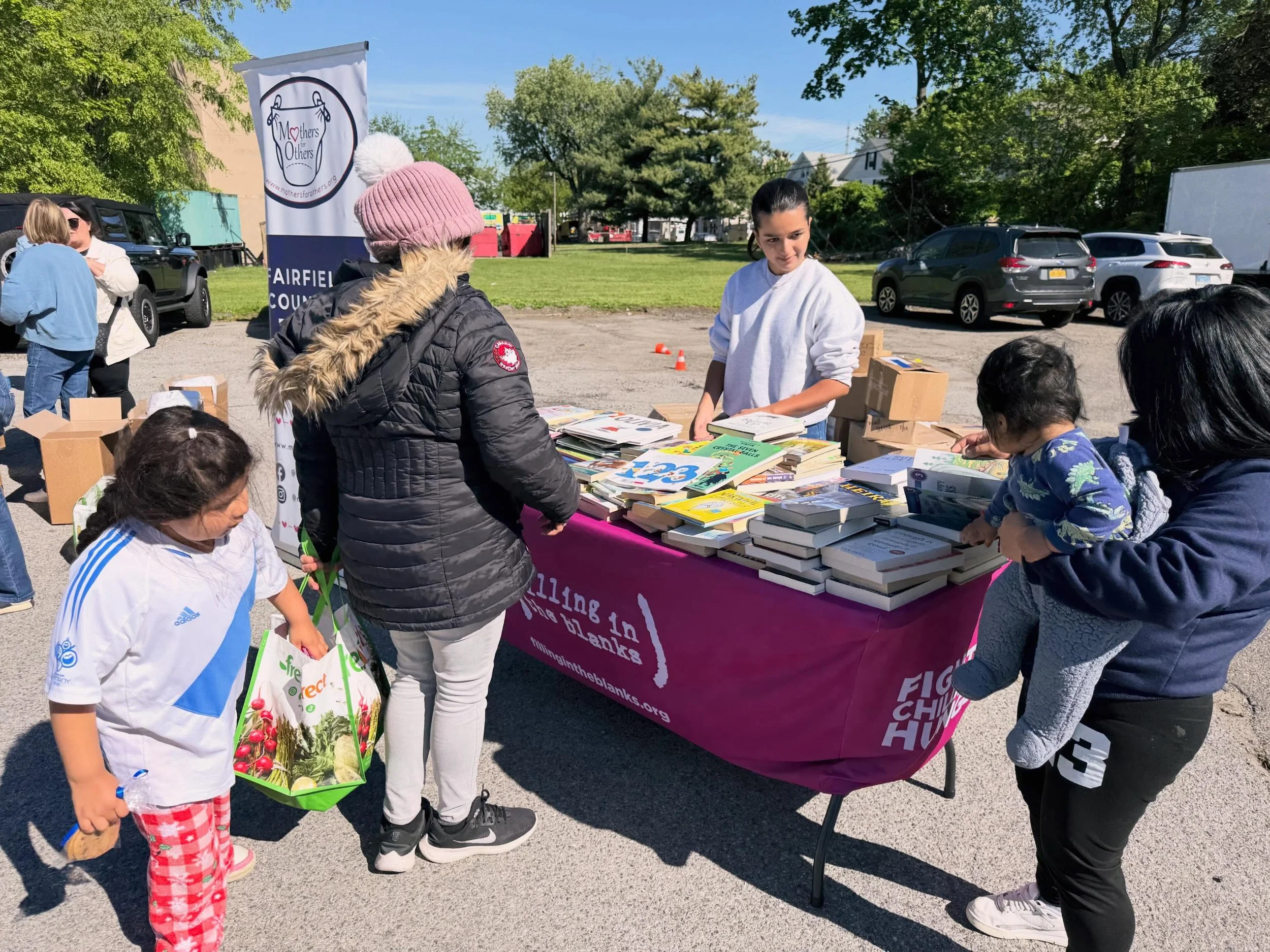 Over 400 books handed out at the Filling in the Blanks mobile food pantry in Stamford