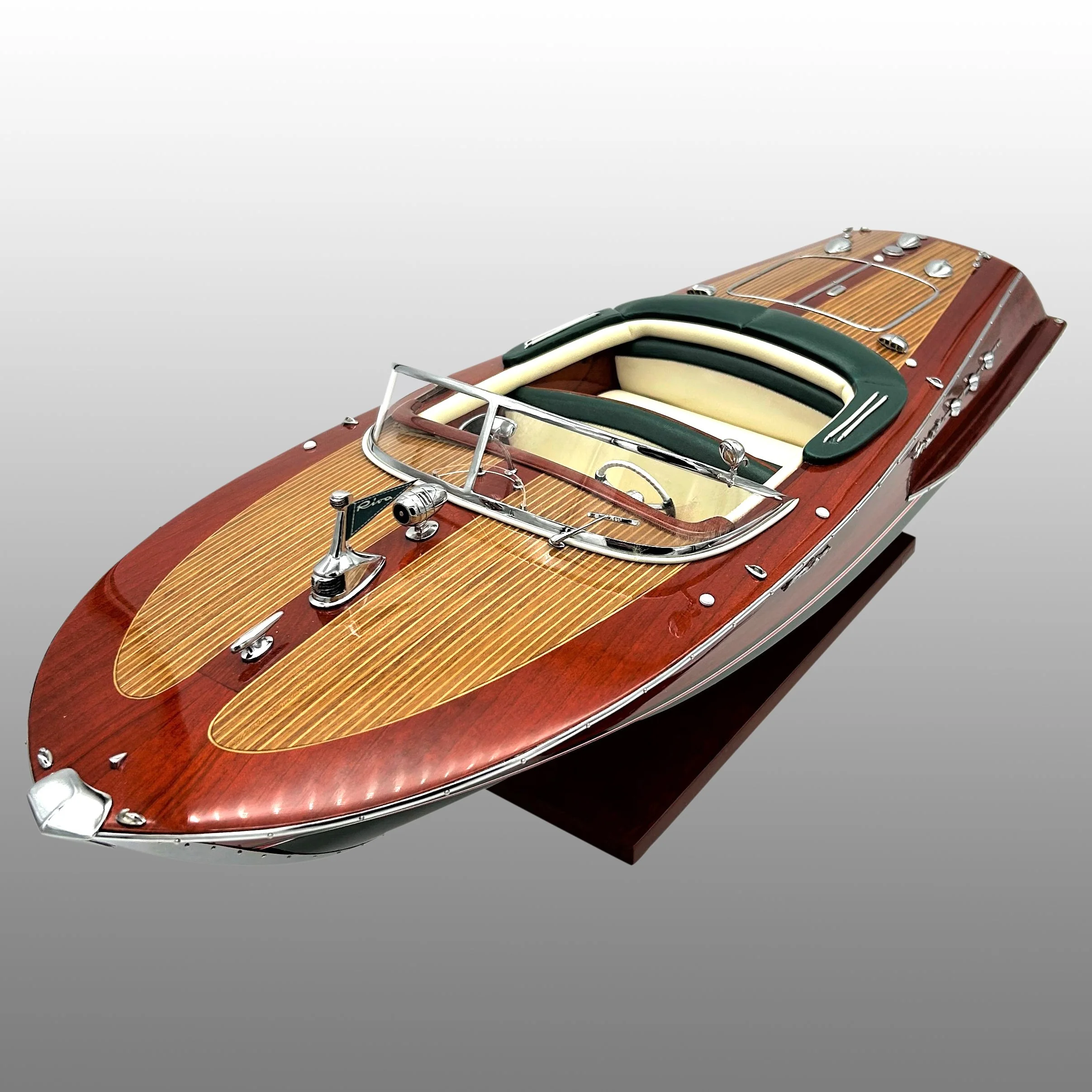 Model of a vintage wooden speedboat with a glossy finish, chrome accents, and interior details.