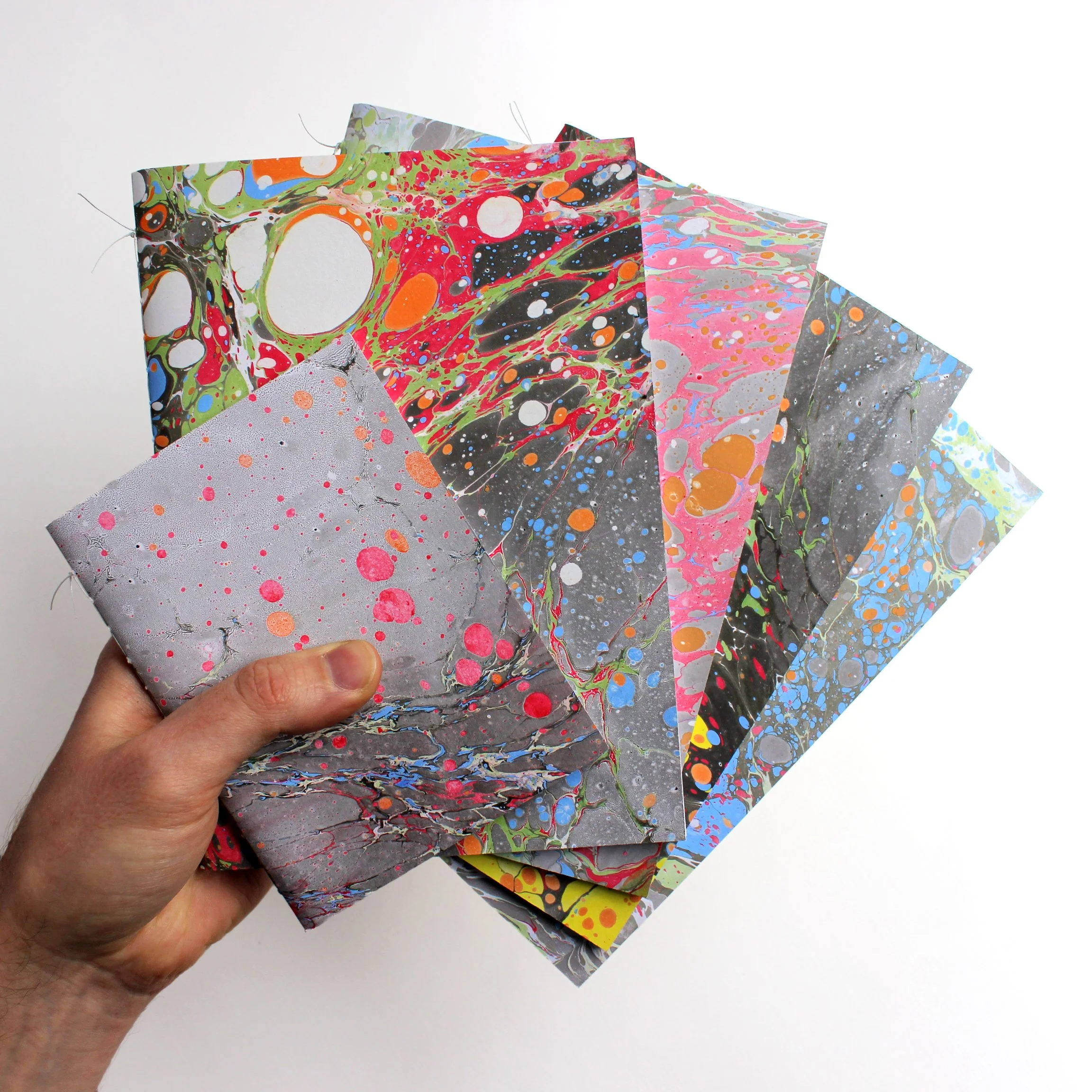 Bōk Bindery

Samsam Petherbridge has hand-bound and marbled many books under the name Bōk Bindery. This process has led to many collaborations and projects. Here are some of his favourites