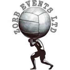 A person holding a large spherical object with the text 'NORB EVENTS LTD' curved above it.
